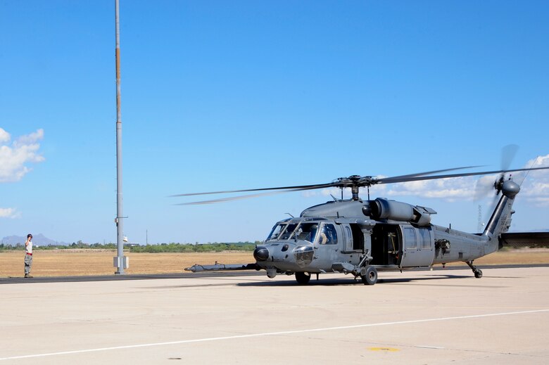 U.S. Air Force Airman 1st Class Phillip Martin, 823d Maintenance Squadron HH-60G Pave Hawk crew chief, prepares to launch a HH-60G Pave Hawk from the 66th Rescue Squadron for a mass casualty exercise during Angel Thunder 2015, at Davis-Monthan Air Force Base, Ariz., June 11, 2015. Angel Thunder is hosted by the 355th fighter Wing at Davis-Monthan AFB but many flying operations will extend throughout Arizona, New Mexico and California. Martin and the 66th RQS are stationed at Nellis AFB, Nev. (U.S. Air Force photo by Senior Airman Betty R. Chevalier/Released)
