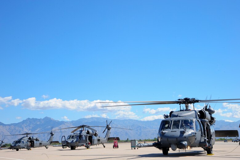 U.S. Air Force HH-60G Pave Hawks sit on the flightline before a mass casualty exercise during Angel Thunder 2015, at Davis-Monthan Air Force Base, Ariz., June 11, 2015. Angel Thunder is hosted by the 355th fighter Wing at Davis-Monthan AFB, but many flying operations extend throughout Arizona, New Mexico and California.  (U.S. Air Force photo by Senior Airman Betty R. Chevalier/Released)