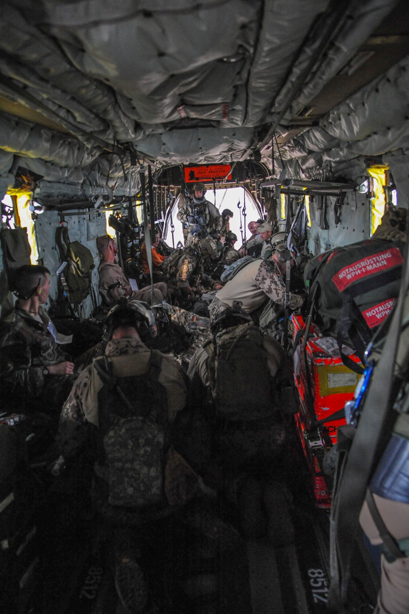 German and U.S. Air Force pararescuemen load and provide care to simulated casualties onto a CH-53GS helicopter after teaming up with partner nation rescue personnel for an Angel Thunder 2015 mass casualty exercise at the Playas Research and Training Center, N.M, June 9, 2015. Victims in the exercise were brought to a casualty collection point where they were triaged and transferred to a U.S. Air Force HH-60 Pave Hawk, U.S. Navy MH-60 Global Hawk or a German CH-53GS for a medical evacuation. (U.S. Air Force photo by Senior Airman Betty R. Chevalier/Released)