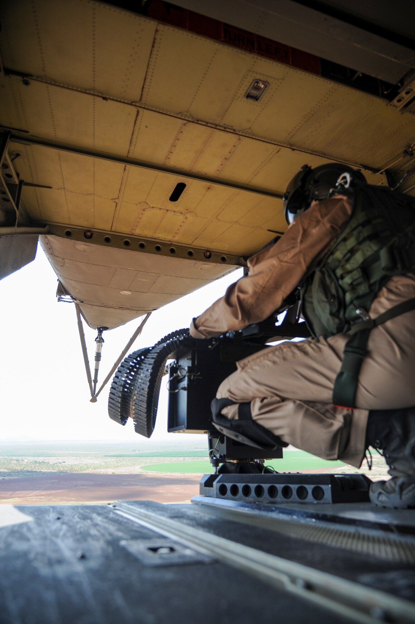 A German Air Force Helicopter Wing 64 aerial gunner monitor’s airspace from the ramp of a German Air Force CH-53GS helicopter during a flight over southern Arizona for Angel Thunder 2015, June 9, 2015. Angel Thunder is the world’s largest personnel recovery exercise, hosting 11 partner nations and nine interagencies with a common goal to train personnel recovery forces to prepare, plan, execute and adapt for a rescue mission. (U.S. Air Force photo by Senior Airman Betty R. Chevalier/Released)
