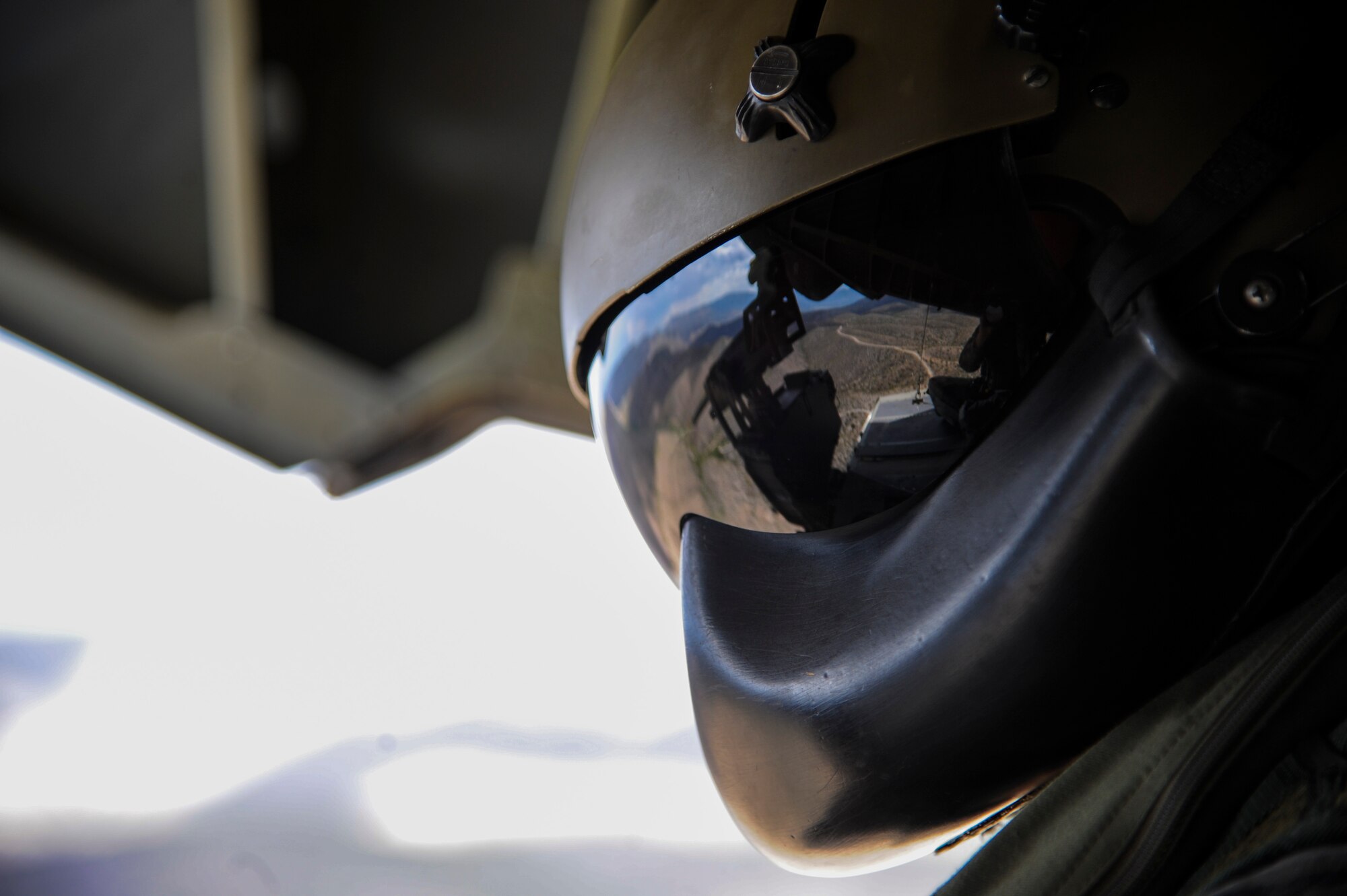 A German Air Force Helicopter Wing 64 aerial gunner views southern Arizona from the ramp of a German Air Force CH-53GS helicopter during a flight for Angel Thunder 2015, June 9, 2015. The German Air Force flew to Bisbee-Douglas International Airport, Ariz., to pick up pararescuemen in support of a mass casualty exercise held at the Playas Research and Training Center, N.M. (U.S. Air Force photo by Senior Airman Betty R. Chevalier/Released)
