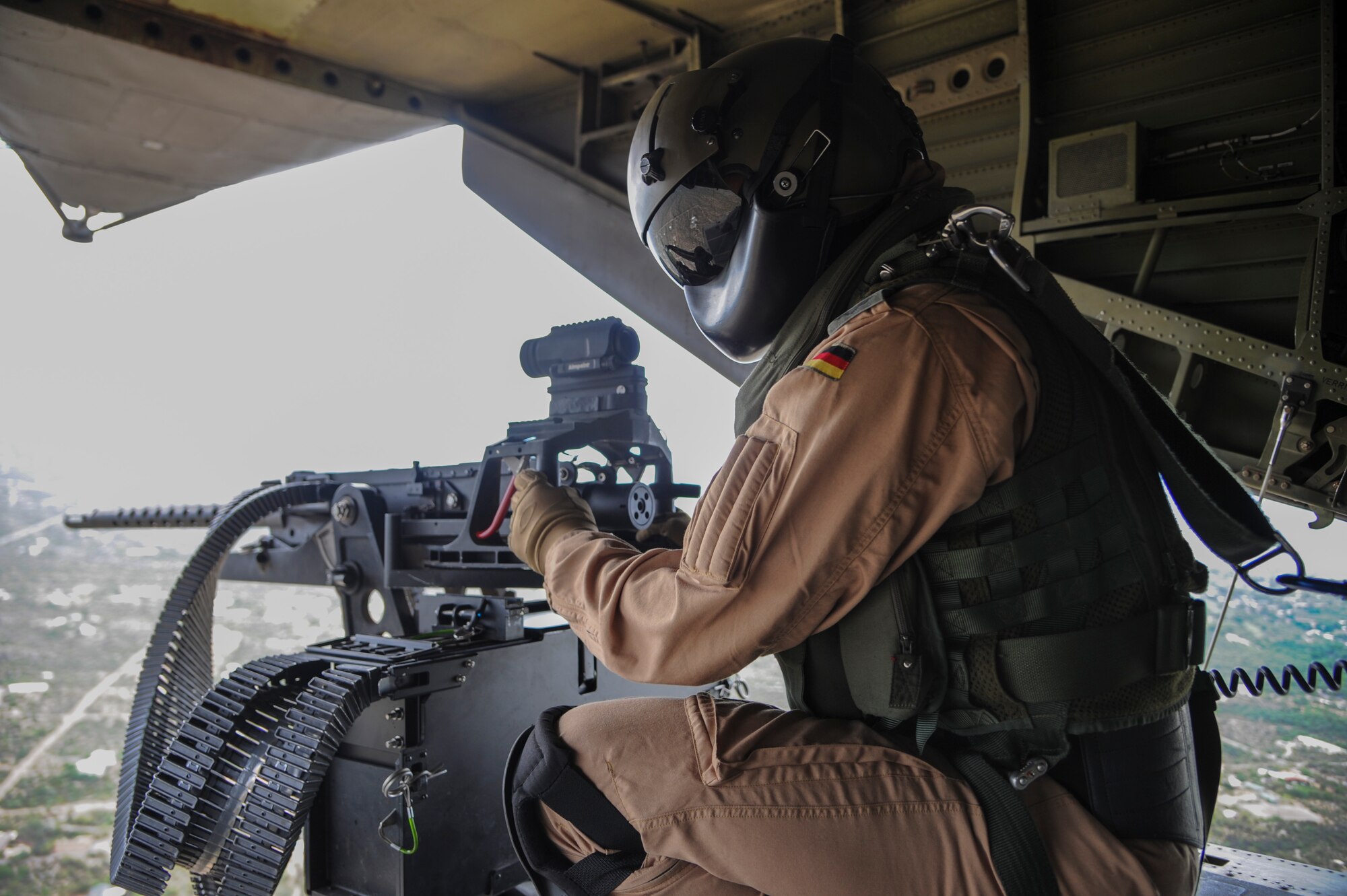A German Air Force Helicopter Wing 64 aerial gunner views Tucson, Ariz., from the ramp of a German Air Force CH-53GS helicopter during Angel Thunder 2015, June 9, 2015. The German Air Force flew to Bisbee-Douglas International Airport, Ariz., to pick up pararescuemen in support of a mass casualty exercise held at the Playas Research and Training Center, N.M. (U.S. Air Force photo by Senior Airman Betty R. Chevalier/Released)
