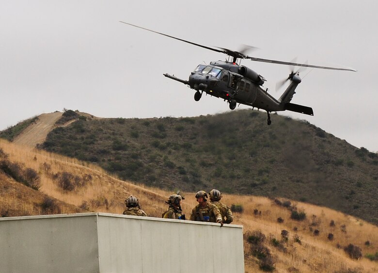 A U.S. Air Force HH-60G Pave Hawk prepares to land during a mass casualty exercise apart of Angel Thunder 2015 at a training site outside of Marine Corps Base Camp Pendleton, Calif., June 11, 2015. The objective of the exercise was to clear the area of opposing forces and stablilze and safely extricate simulated casualties. (U.S. Air Force photo by Airman 1st Class Chris Drzazgowski/Released)
