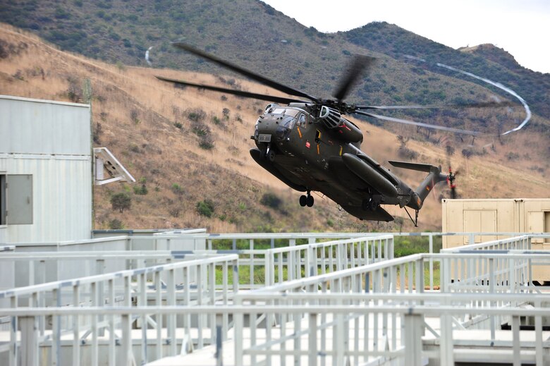 A German army CH-53GS aircraft carrying U.S. and German service members, prepares to land during a mass casualty exercise apart of Angel Thunder 2015 at a training site outside of Marine Corps Base Camp Pendleton, Calif., June 11, 2015. The objective of the exercise was to clear the area of opposing forces and stablilze and safely extricate simulated casualties. (U.S. Air Force photo by Airman 1st Class Chris Drzazgowski/Released)