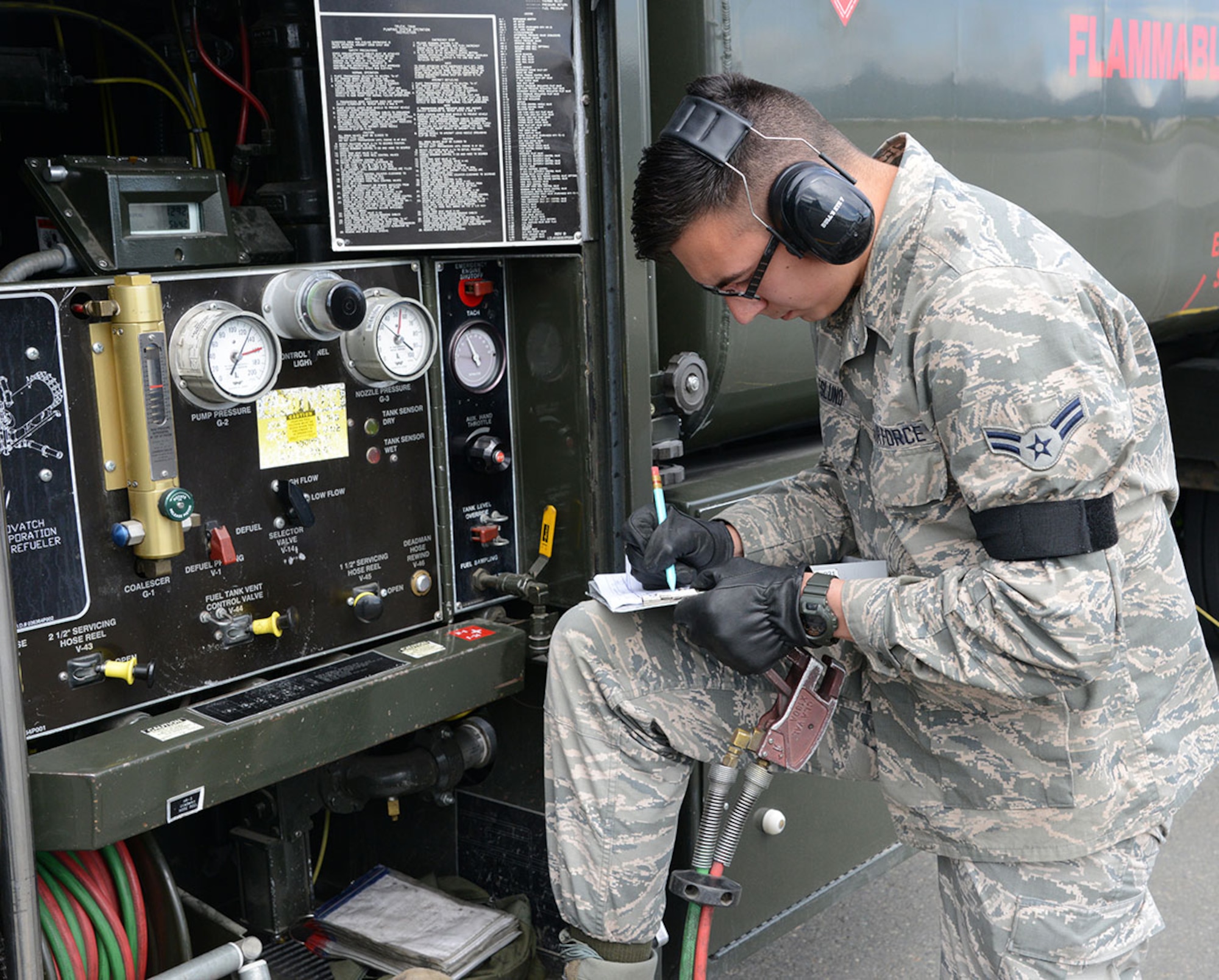 Airman 1st Class Erich Neslund, 673d Logistics Readiness Squadron fuels specialist, runs through a refueling checklist on the Joint Base Elmendorf-Richardson flightline June 8. The Air Force recently recognized the 673d Logistics Readiness Squadron’s Fuels Management Flight as the best in the Air Force after the flight was named the winner of the 2014 American Petroleum Institute Award. (U.S. Air Force photo/Staff Sgt. Wes Wright)