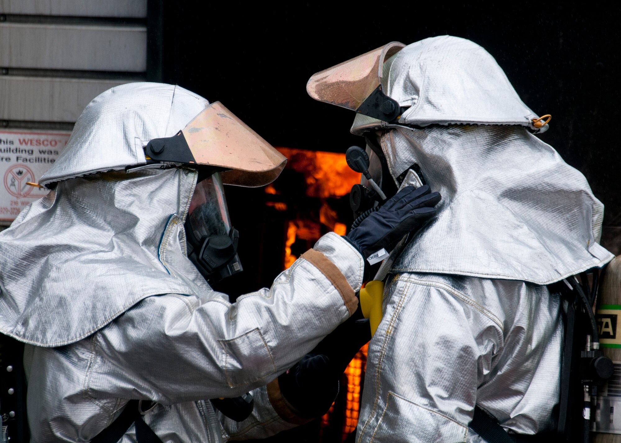 Members of the 446th Civil Engineer Squadron Fire Protection Flight train on putting out structural fires at Fort McCoy WI. during Patriot Warrior, June 10th, 2015. Patriot Warrior is an Air Force Reserve Command exercise performed in a joint environment with U.S. Army and Navy Reserves, active duty and Air National Guard partners designed to evaluate the capability to deploy, establish and operate in support of joint operations. Nearly 6,000 U.S. Army Reserve, Navy Reserve and AFRC personnel took part in the exercise. The 446th Fire Protection Flight trained daily to keep their skills sharp in case of real world incidents during the exercise. (U.S. Air Force photo by Senior Airman Daniel Liddicoet/Released)