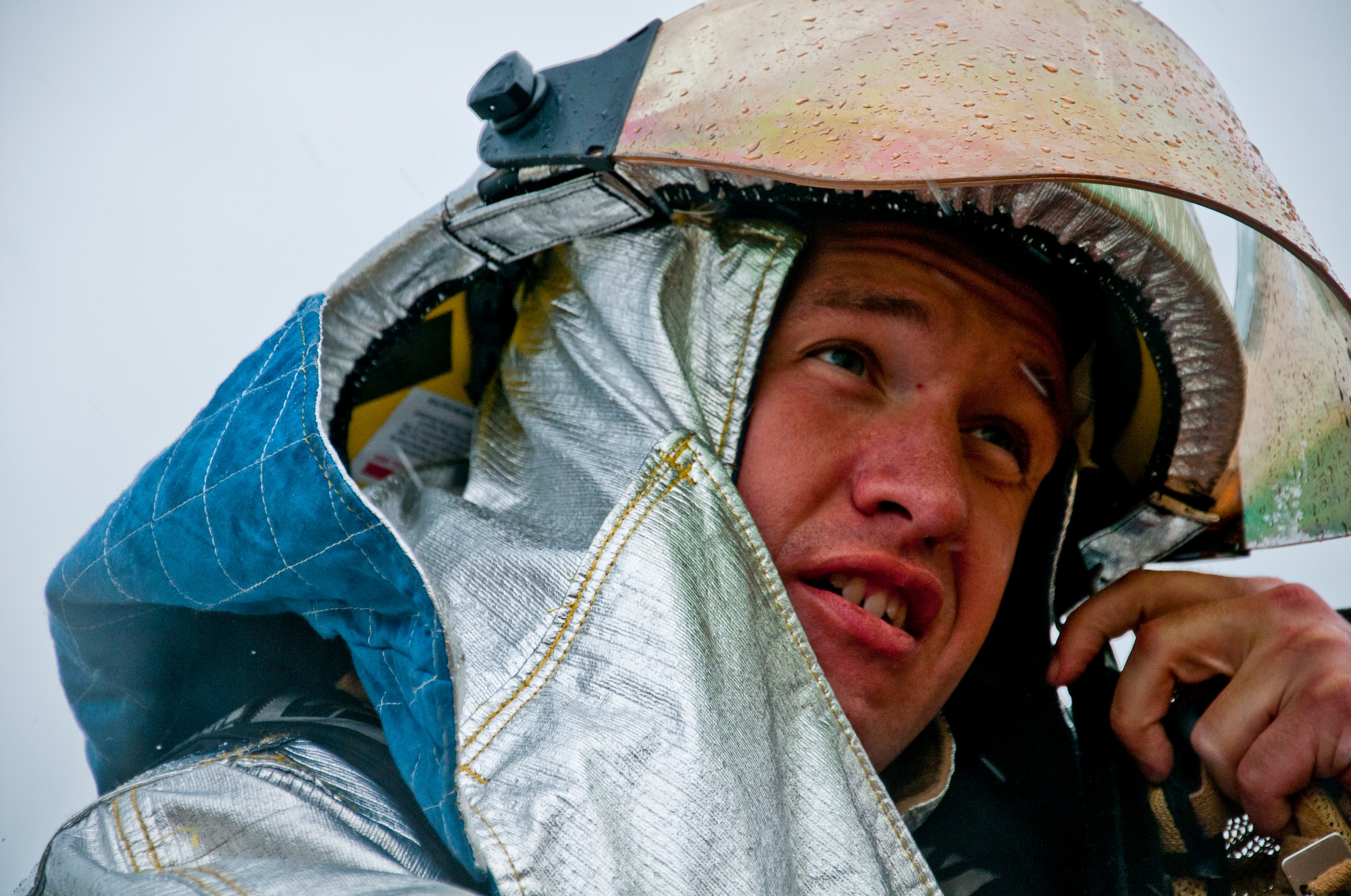 TSgt. Shawn Walker, 446th Civil Engineer Squadron Fire Protection Flight crew chief, suits up before training to rescue victims from a tent filled with smoke at Fort McCoy WI. during Patriot Warrior, June 11th, 2015. Patriot Warrior is an Air Force Reserve Command exercise performed in a joint environment with U.S. Army and Navy Reserves, active duty and Air National Guard partners designed to evaluate the capability to deploy, establish and operate in support of joint operations. Nearly 6,000 U.S. Army Reserve, Navy Reserve and AFRC personnel took part in the exercise. The 446th Fire Protection Flight trained daily to keep their skills sharp in case of real world incidents during the exercise. (U.S. Air Force photo by Senior Airman Daniel Liddicoet/Released)