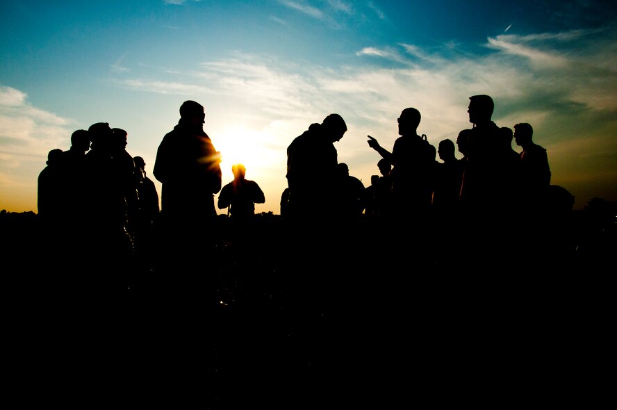 Members of the 446th Civil Engineer Squadron Fire Protection Flight meet before training to put out a JP8 jet fuel fire at Fort McCoy WI. during Patriot Warrior, June 10th, 2015. Patriot Warrior is an Air Force Reserve Command exercise performed in a joint environment with U.S. Army and Navy Reserves, active duty and Air National Guard partners designed to evaluate the capability to deploy, establish and operate in support of joint operations. Nearly 6,000 U.S. Army Reserve, Navy Reserve and AFRC personnel took part in the exercise. The 446th Fire Protection Flight team had a unique opportunity to train with JP8 jet fuel during the exercise, which simulates the conditions of real fires they might encounter much more closely than propane. (U.S. Air Force photo by Senior Airman Daniel Liddicoet/Released)