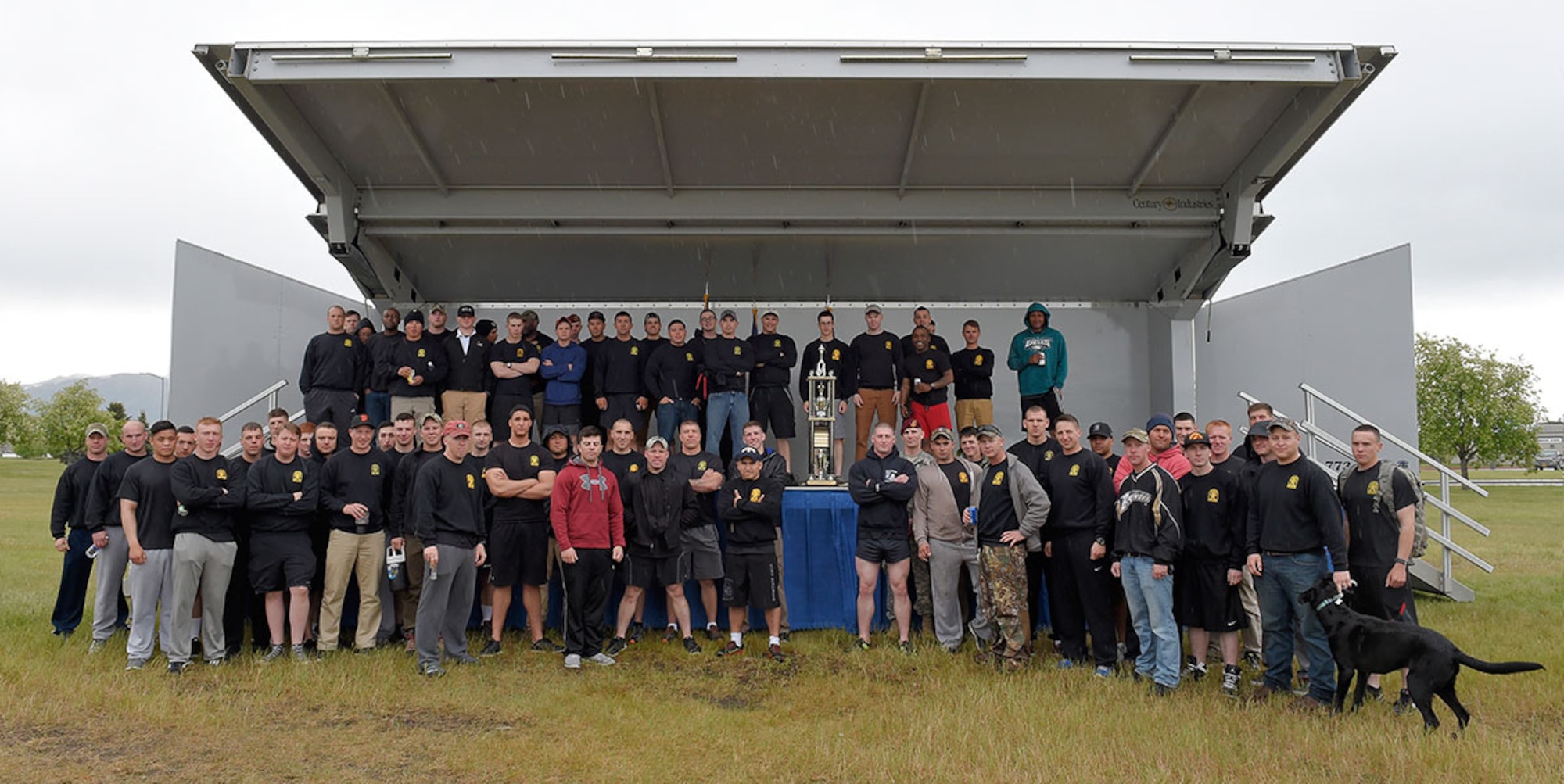 Soldiers assigned to 3rd Battalion (Airborne), 509th Infantry Regiment pose for a group photo after placing first in the Arctic Warrior Olympics on JBER, June 5. For the third year in a row the winning team was from the Army. (U.S. Air Force photo/Alejandro Pena)