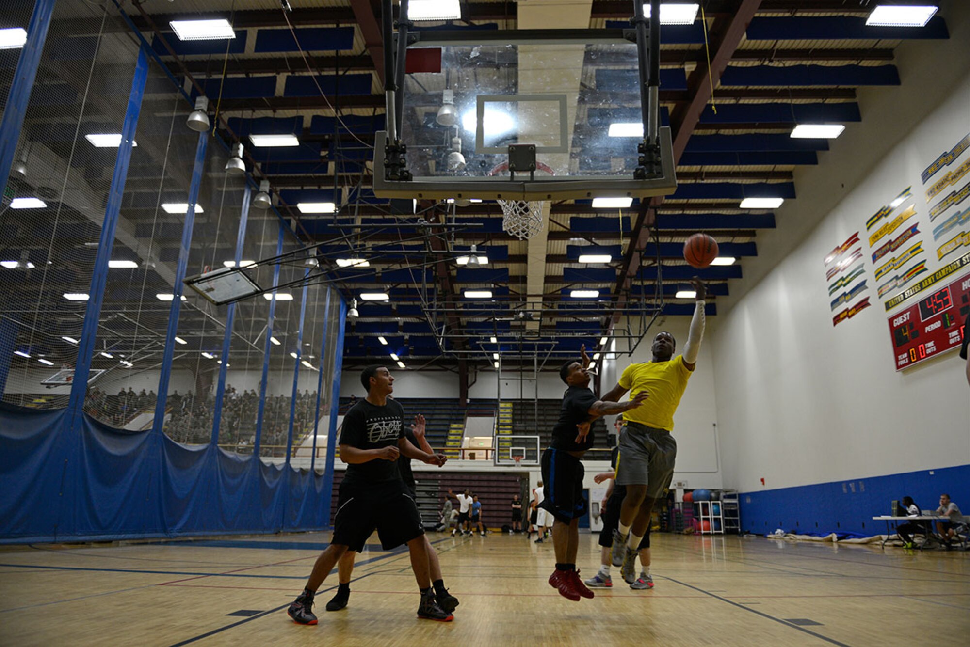 Soldiers participate in a 3-on-3 basketball game during the Arctic Warrior Olympics. The events are hosted every June to promote healthy competition and bring the community of JBER together. (U.S. Army photo/Sachel Harris)