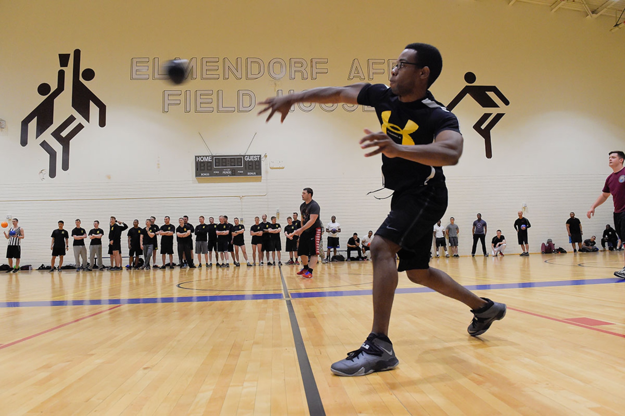 A Soldier throws a ball at an opponent during a dodgeball game on JBER, June 5. The dodgeball game was part of the Arctic Warrior Olympics hosted every June to promote healthy competition and bring the community on JBER together. (U.S. Air Force photo/Alejandro Pena)