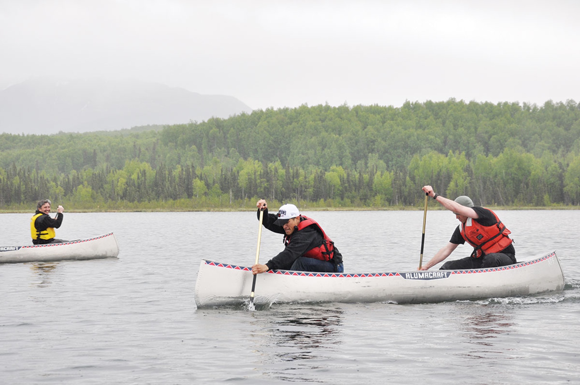 Cpl. Xavier Gonzalez, an infantryman and Army 1st Lt. Richard Fink, both of C-Company, 3rd Battalion (Airborne), 509th Infantry Regiment paddle a canoe on JBER’s Otter Lake in a race against time. The two took second place with a time of 8 minutes, 42 seconds. (U.S. Air Force photo/Erin Eaton)