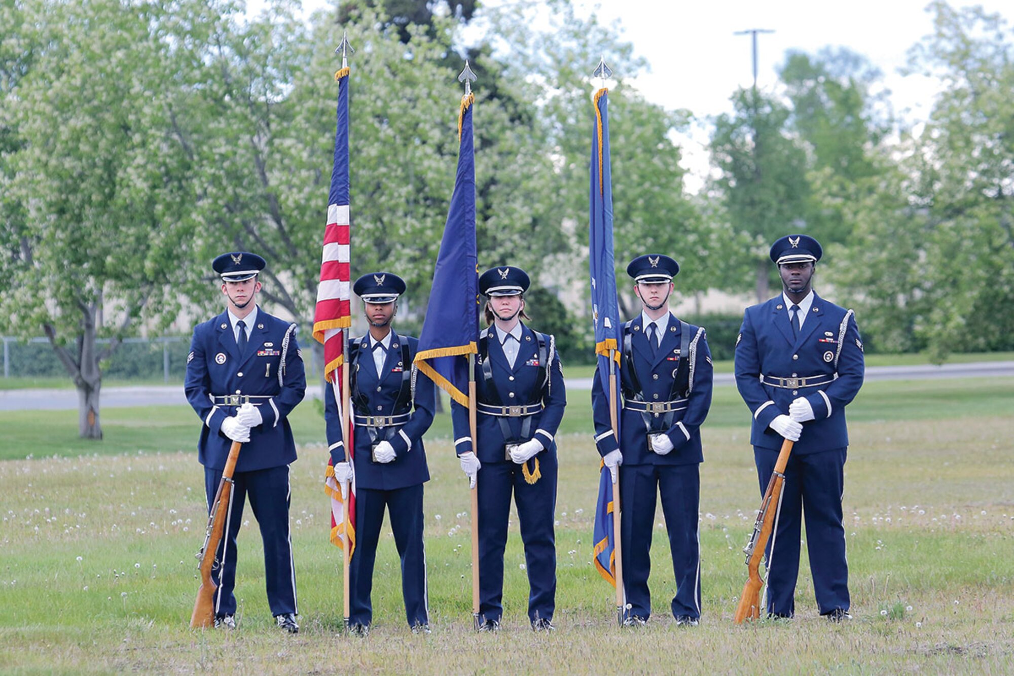 Airmen assigned to the Joint Base Elmendorf-Richardson honor guard standby to present the colors during the opening ceremony of the Arctic Warrior Olympics on JBER, June 5. The Arctic Warrior Olympics which promote healthy competition and community cohesion are hosted every June on JBER in conjunction with the Military Appreciation Picnic honoring Service members, families and Department of Defense civilian employees. (U.S. Air Force photo/Alejandro Pena)