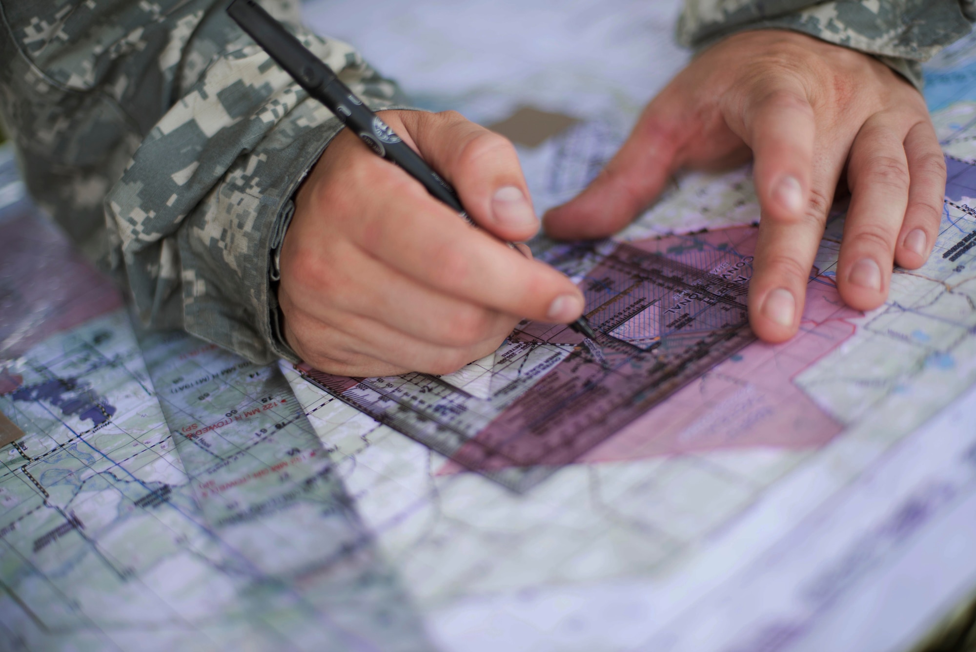 U.S. Army Sgt. Christopher Nance, 3-27th Field Artillery Regiment 2nd Fires Platoon operations chief, maps target areas during Exercise DRAGON STRIKE June 10, 2015, at Avon Park Air Force Range, Fla. Nance and his platoon coordinated with 93d Air Ground Operations Wing joint terminal attack controllers on where to launch their M142 High Mobility Artillery Rocket System rockets for accurate threat elimination. (U.S. Air Force photo by Airman 1st Class Dillian Bamman/Released)