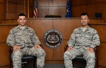 Senior Airman Sergio Espinoza, left, and Airman 1st Class Brendon Enriquez, right, 2nd Bomb Wing military justice paralegals, pose for a photo on Barksdale Air Force Base, La., June 11, 2015. After joining the Air Force, the Airmen put together a citizenship package, were interviewed, passed a U.S. history test and took the Oath of Allegiance to become U.S. citizens. (U.S. Air Force photo/Airman 1st Class Curt Beach)