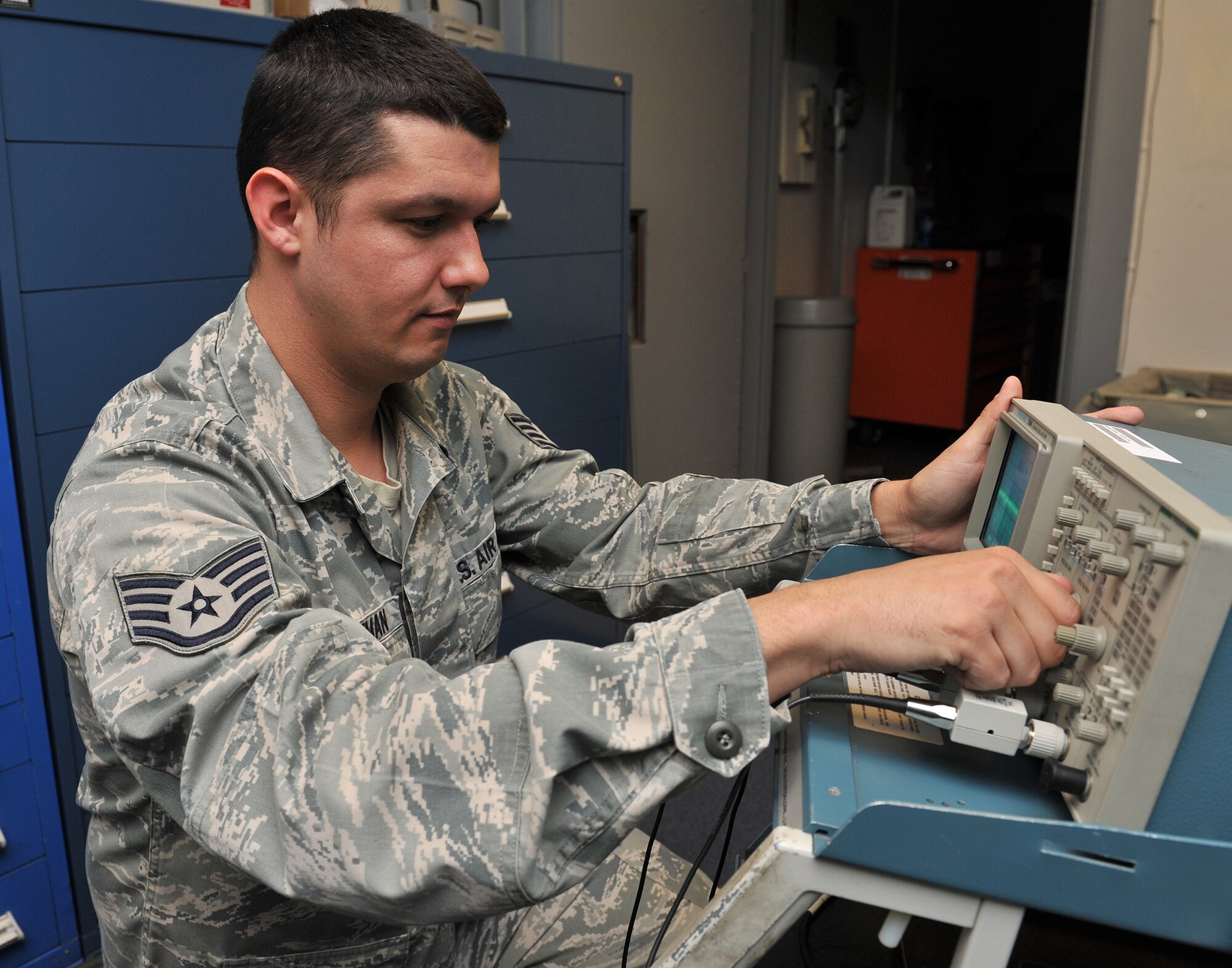 Staff Sgt. Donald Hoffman, 341st Missile Maintenance Squadron missile communications critical task supervisor, uses an oscilloscope to check the alignment of the read/write head of mass storage unit June 10 at Malmstrom Air Force Base, Mont. The missile communications section has its own electronics laboratory, and maintains and repairs communications systems used in Malmstrom’s 15 launch control centers and the Support Information Network to 150 launch facilities. (U.S. Air Force photo/John Turner)