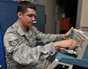 Staff Sgt. Donald Hoffman, 341st Missile Maintenance Squadron missile communications critical task supervisor, uses an oscilloscope to check the alignment of the read/write head of mass storage unit June 10 at Malmstrom Air Force Base, Mont. The missile communications section has its own electronics laboratory, and maintains and repairs communications systems used in Malmstrom’s 15 launch control centers and the Support Information Network to 150 launch facilities. (U.S. Air Force photo/John Turner)