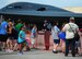 A pilot with the U.S. Air Force Thunderbirds signs an autograph for a spectator June 14, 2015, during the Wings Over Whiteman air show at Whiteman Air Force Base, Mo. The U.S. Air Force Air Demonstration Squadron performs precision aerial maneuvers demonstrating the capabilities of Air Force high performance aircraft to people throughout the world. (U.S. Air Force photo by Senior Airman Joel Pfiester/Released)