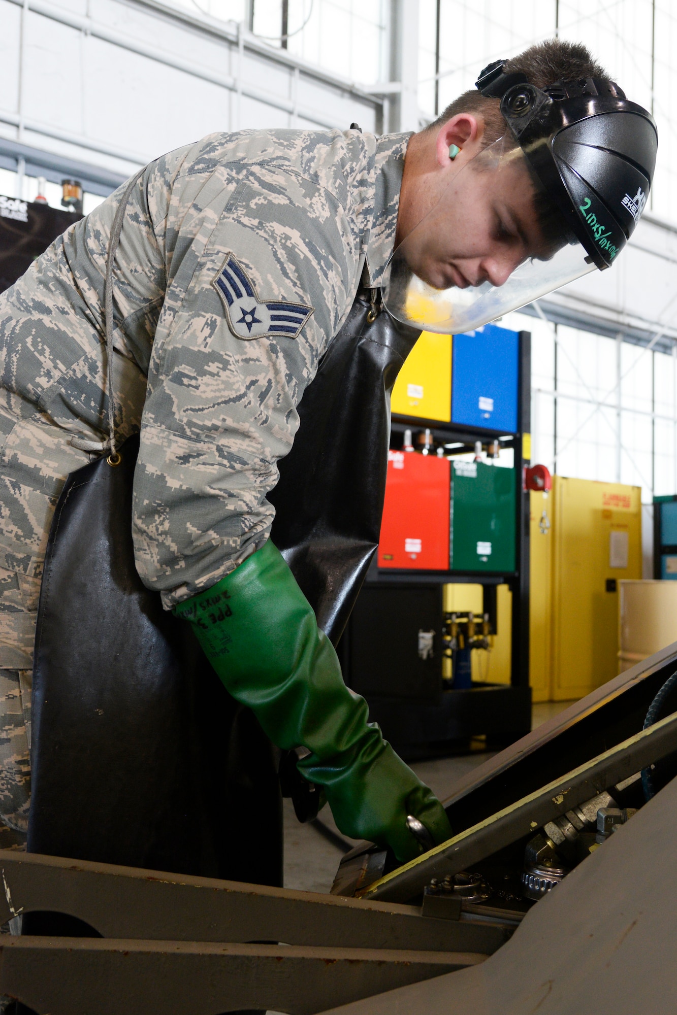 Senior Airman Eric Hawkins, 2nd Maintenance Squadron aerospace ground equipment journeyman, uses the new oil safe lubrication work center system to service a jammer at Barksdale Air Force Base, La., June 12, 2015. The new system reduced the risk of cross contamination while saving the unit $8,000 in annual waste. (U.S. Air Force photo/Tech. Sgt. Marie Brown)