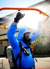 Airman 1st Class Robert Rybicky, 9th Aerospace Medicine Squadron bioenvironmental technician, begins decontamination as part of an exercise on June 11, 2015 at Beale Air Force Base, California. The exercise was part of the Integrated Base Emergency Response Capabilities Training designed to strengthen Airmen’s emergency response skills. (U.S. Air Force photo by Airman Preston L. Cherry/Released)