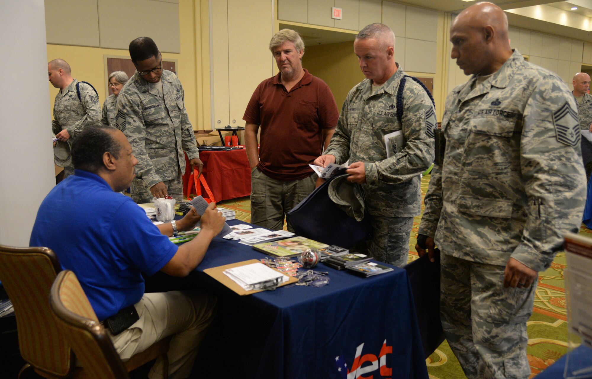 Members of Team Keesler receive information about the Vet Center’s Readjustment Counseling Service from Henry McNeal, Biloxi Vet Center outreach specialist, at the Wingman Week Resilience Fair, June 12, 2015, Keesler Air Force Base, Miss. The fair gave Airmen, dependents and base personnel information about different programs provided through on and off base agencies. (U.S. Air Force photo by Senior Airman Holly Mansfield) 