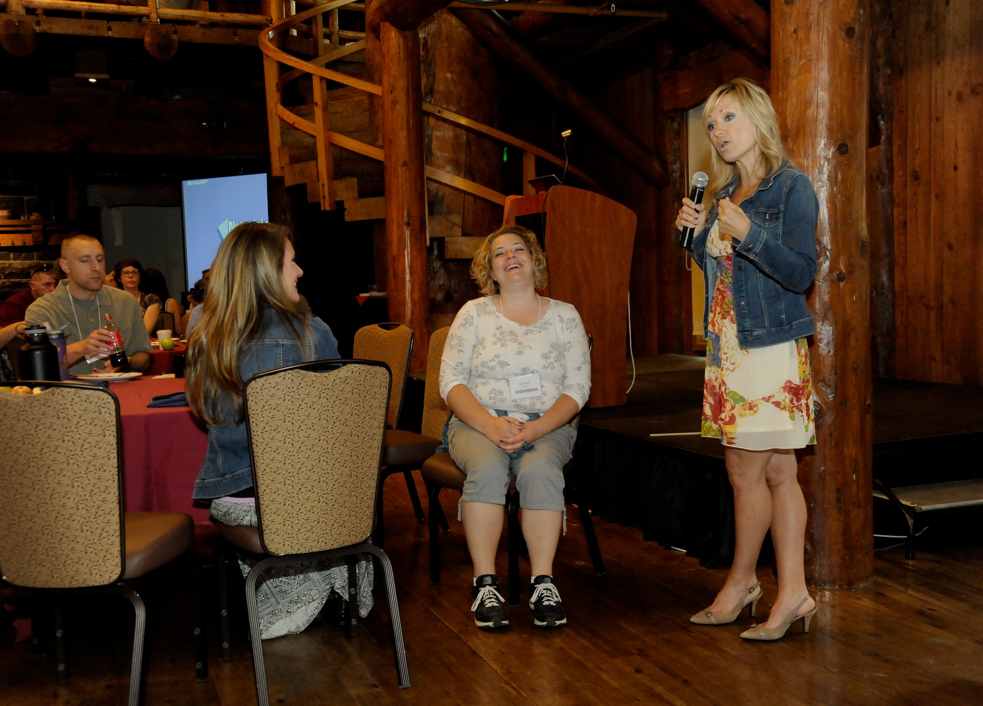 Director of Psychological Health for the 142nd Fighter Wing, Dr. DeAnn Smetana, right, discusses stress and health related topics to the Airmen and families attending the Yellow Ribbon event weekend held at Sunriver Resort, Bend, Ore., May 31, 2015. (U.S. Air National Guard photo by Tech. Sgt. John Hughel, 142nd Fighter Wing Public Affairs /Released)