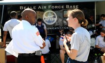 SSgt Michaela Spiegle (right), 9th Aerospace Medicine Squadron bioenvironmental engineering technician, briefs Carey Waddell, 9th Civil Engineer Squadron exercise incident commander, as part of an exercise on June 11, 2015 at Beale Air Force Base, California. The exercise was part of the Integrated Base Emergency Response Capabilities Training designed to strengthen Airmen’s emergency response skills. (U.S. Air Force photo by Airman Preston L. Cherry/Released)