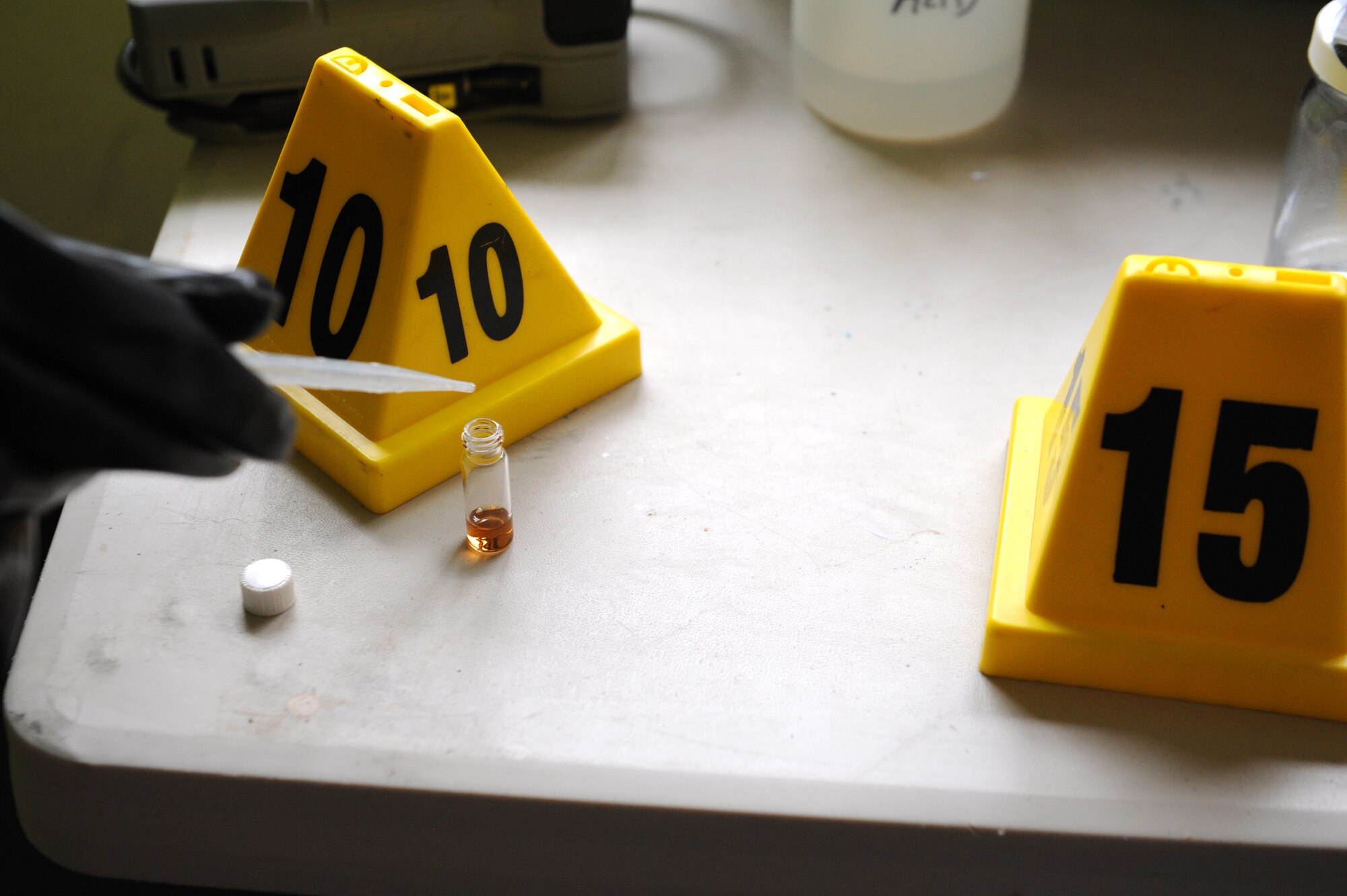 A Beale emergency management technician, from the 9th Civil Engineering Squadron, samples a chemical found at a simulated hazardous scene as part of an exercise on June 10, 2015 at Beale Air Force Base, California. The exercise was part of the Integrated Base Emergency Response Capabilities Training designed to strengthen Airmen’s emergency response skills. (U.S. Air Force photo by Airman Preston L. Cherry/Released)