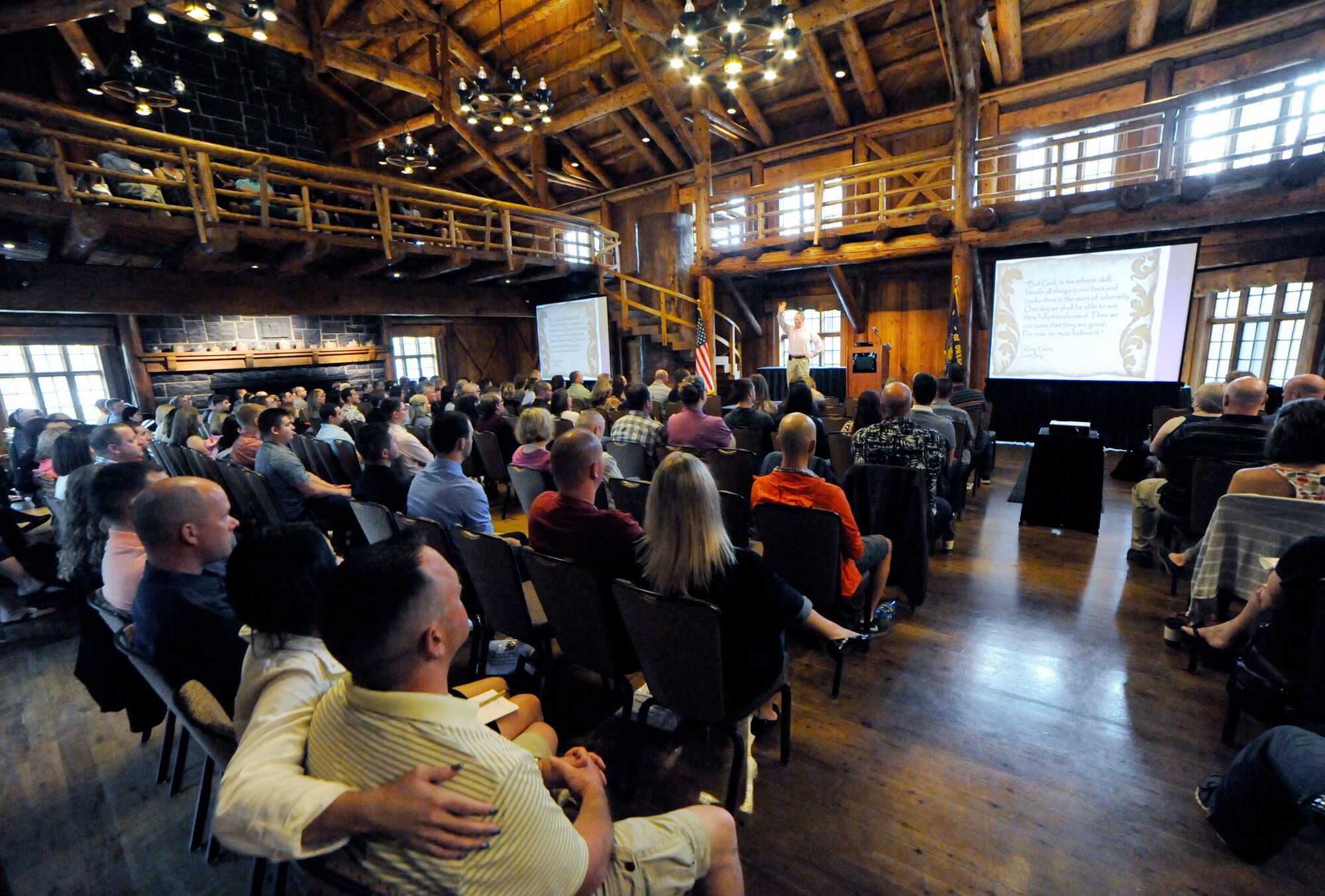 Oregon Air National Guard members attending the Yellow Ribbon Reintegration Program (YRRP) event   held at the Sunriver Resort, Bend, Ore., May 30, 2015, listen to Key Note Speaker Col. (ret) Terry Larkin discuss adversity as part of the opening program for the three day weekend of events. (U.S. Air National Guard photo by Tech. Sgt. John Hughel, 142nd Fighter Wing Public Affairs /Released)