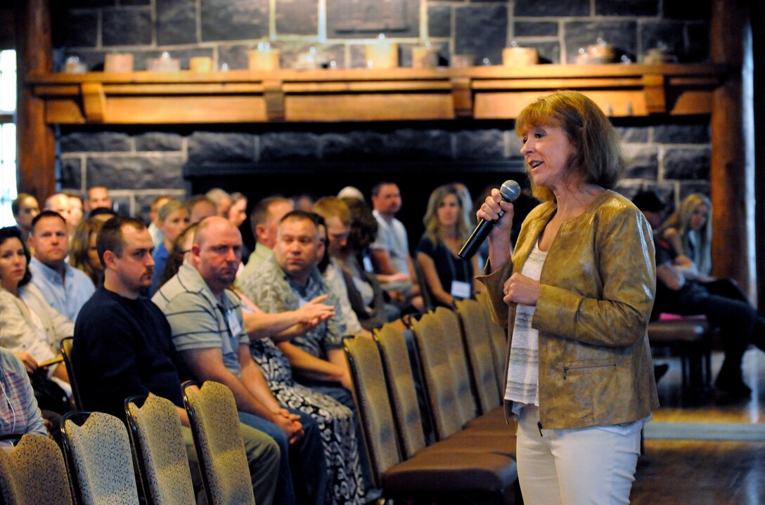 Col. Donna Prigmore, 142nd Fighter Wing vice commander, delivers the opening address to deploying Oregon Air National Guard Airmen and their families at the Yellow Ribbon Reintegration Program (YRRP) event held May 29-31, 2015 at the Sunriver Resort, Bend, Ore. Prigmore’s remarks focused on the importance of the mission and the family members left behind that also need the support from the unit. (U.S. Air National Guard photo by Tech. Sgt. John Hughel, 142nd Fighter Wing Public Affairs /Released)