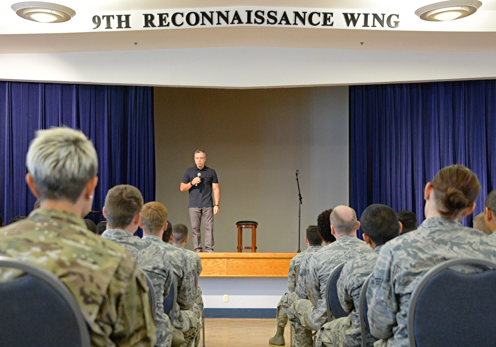 Comedian Bernie McGrenahan performs, “Comedy with a Message,” June 12, 2015, at Beale Air Force Base, California. McGrenahan began his comedy tour in 1995 to promote resiliency, safety, bystander intervention and respect. He also shares his experiences overcoming addiction. (U.S. Air Force photo by Airman 1st Class Ramon A. Adelan/Released) 