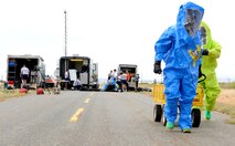 Airman 1st Class Robert Rybicky (left), 9th Aerospace Medicine Squadron bioenvironmental technician, and Senior Airman Kent Hunter, 9th Civil Engineer Squadron emergency management technician, walk to a simulated hazardous scene for an exercise on June 10, 2015 at Beale Air Force Base, California. The exercise was part of the Integrated Base Emergency Response Capabilities Training designed to strengthen Airmen’s emergency response skills. (U.S. Air Force photo by Airman Preston L. Cherry/Released)