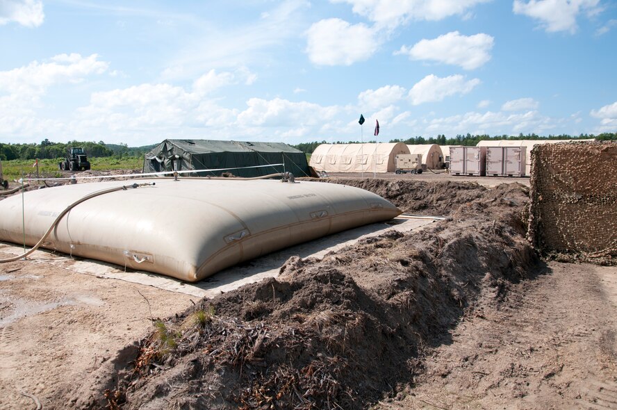 Shower, laundry, and drinking water facilities set up by the 446th CES are shown at Fort McCoy, WI. during Patriot Warrior, June 7th, 2015. Patriot Warrior is the Air Force Reserve Command portion of a much larger joint expeditionary exercise involving almost 6,000 Sailors, Soldiers, Airmen and multinational forces. Formerly known as Global Medic, the exercise still focuses primarily on aeromedical training and readiness, but has evolved over time to become much more multi-faceted. Members of the 446th CES provided all the essential living facilities needed to sustain exercises in the field. (U.S. Air Force photo by Senior Airman Daniel Liddicoet/Released)