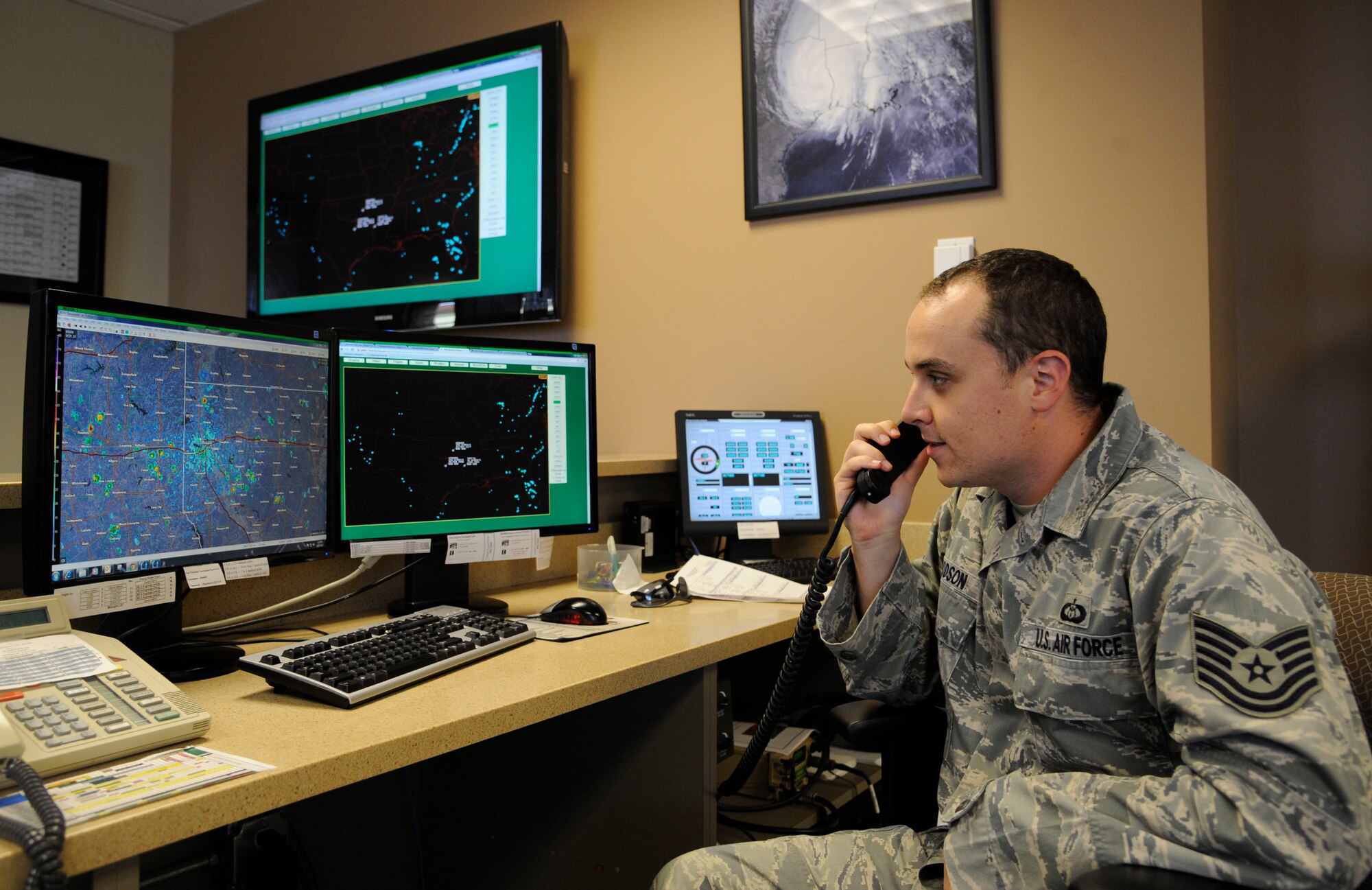 Tech. Sgt. Larry Woodson, 2nd Operations Support Squadron weather technician, communicates with aircrew on Barksdale Air Force Base, La., Aug. 22, 2013. Weather technician's responsibilities include briefing aircrew on weather conditions and supporting Barksdale's mission of getting B-52H Stratofortress bombers in the air by providing weather updates in real time. (U.S. Air Force photo/Airman 1st Class Andrew Moua)
