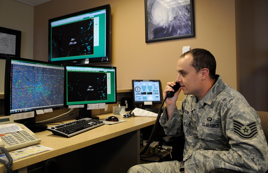 Tech. Sgt. Larry Woodson, 2nd Operations Support Squadron weather technician, communicates with aircrew on Barksdale Air Force Base, La., Aug. 22, 2013. Weather technician's responsibilities include briefing aircrew on weather conditions and supporting Barksdale's mission of getting B-52H Stratofortress bombers in the air by providing weather updates in real time. (U.S. Air Force photo/Airman 1st Class Andrew Moua)
