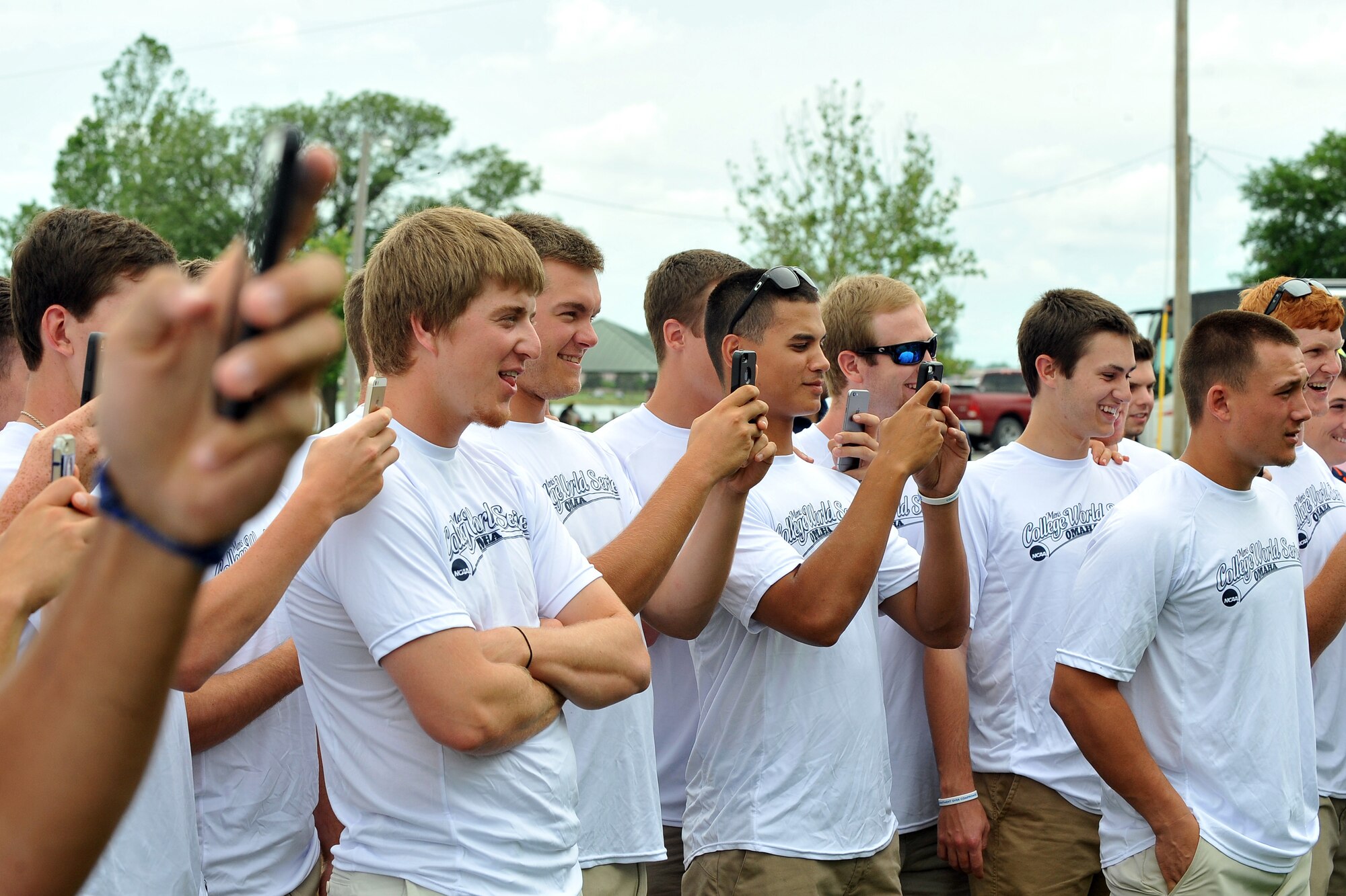 Players and coaches from the University of Virginia Cavaliers visited Offutt Air Force Base, Nebraska, June 14, following their 5-3 opening tournament victory over the Arkansas Razorbacks June 13, at the 2015 NCAA College World Series in Omaha. The Cavaliers were welcomed by the 55th Wing vice commander, ate lunch with some active duty members and were treated to a military working dog demonstration by the 55th Security Forces Squadron. Each year Offutt serves as a host one of the eight teams at the College World Series (U.S. Air Force photo by Josh Plueger/Released).