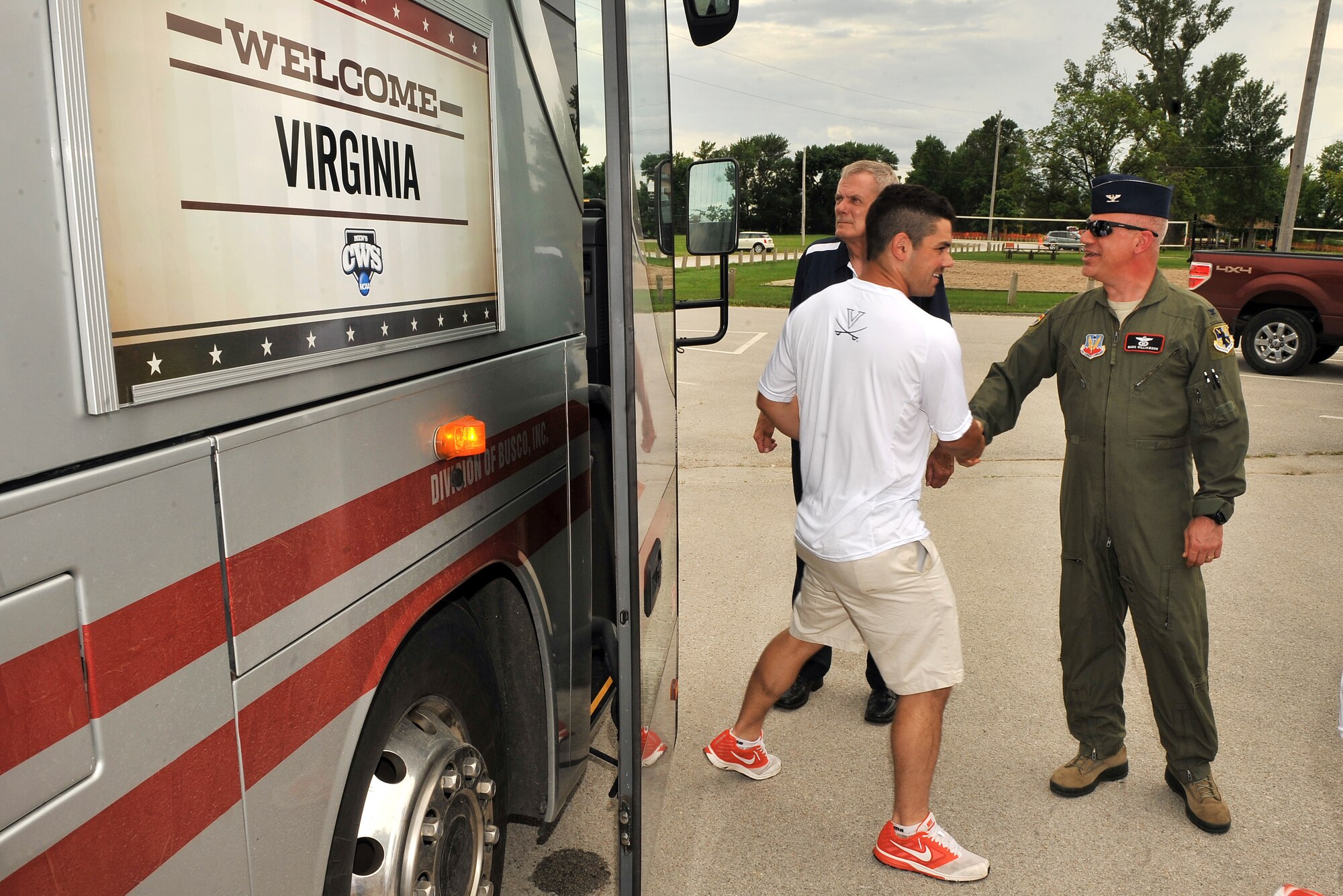 U.S. Air Force Col. Mark Williamson, 55th Wing vice commander, greets players and coaches from the University of Virginia Cavaliers as they visited Offutt Air Force Base, Nebraska, June 14, following their 5-3 opening tournament victory over the Arkansas Razorbacks June 13, at the 2015 NCAA College World Series in Omaha. The Cavaliers ate lunch with some active duty members and were treated to a military working dog demonstration by the 55th Security Forces Squadron. Each year Offutt serves as a host one of the eight teams at the College World Series (U.S. Air Force photo by Josh Plueger/Released).