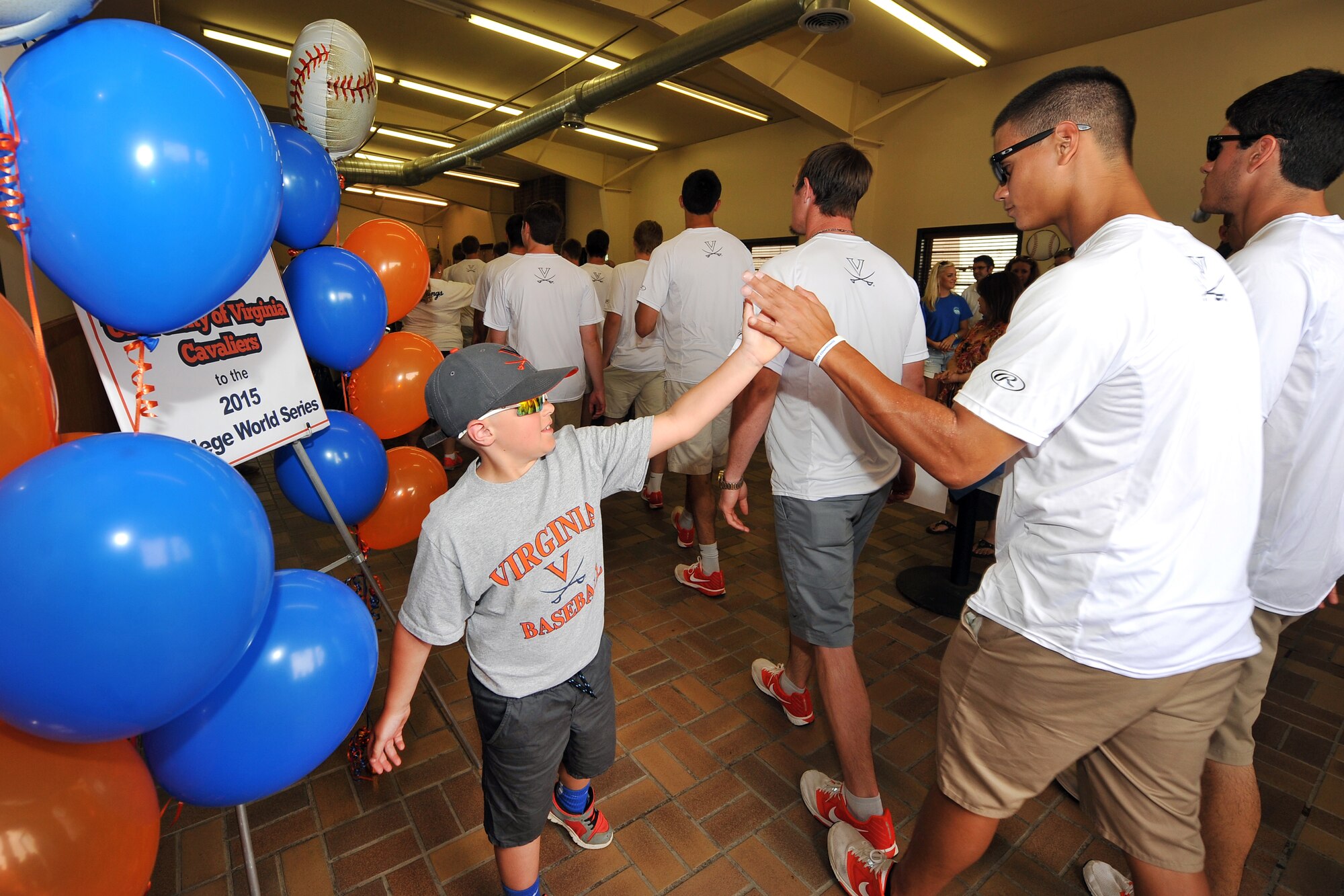 Players and coaches from the University of Virginia Cavaliers visited Offutt Air Force Base, Nebraska, June 14, following their 5-3 opening tournament victory over the Arkansas Razorbacks June 13, at the 2015 NCAA College World Series in Omaha. The Cavaliers were welcomed by the 55th Wing vice commander, ate lunch with some active duty members and were treated to a military working dog demonstration by the 55th Security Forces Squadron. Each year Offutt serves as a host one of the eight teams at the College World Series (U.S. Air Force photo by Josh Plueger/Released).