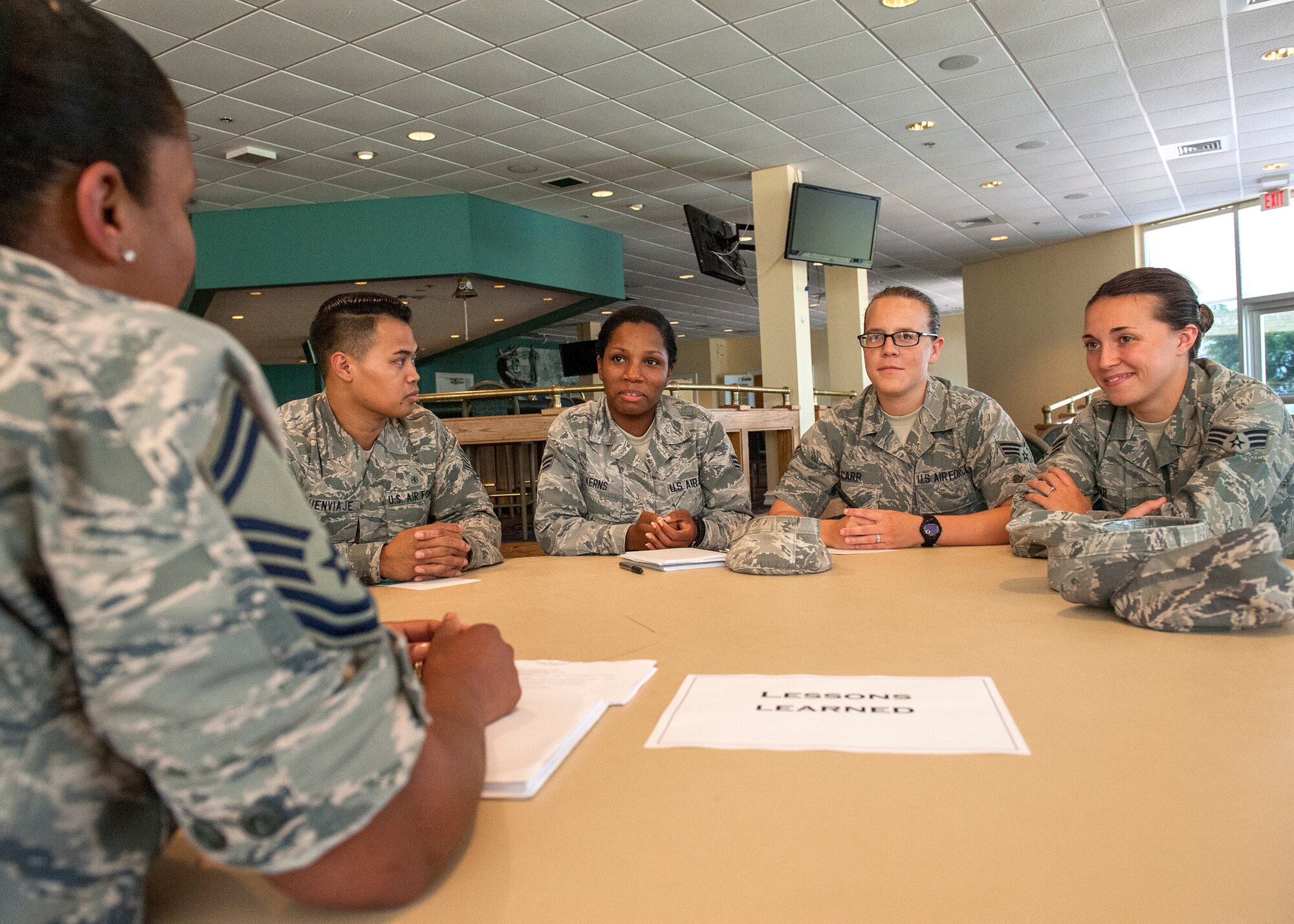 Junior enlisted Airmen listen as a senior enlisted leader speaks during the 96th Medical Group’s Junior Enlisted Advisory Council Speed Mentoring event June 11 at the Bayview Club at Eglin Air Force Base, Fla. During the event Airmen rotated through seven stations with five minutes at each, to talk with senior enlisted leaders about different topics ranging from enlisted performance reports to lessons learned. The JEAC holds the quarterly event to provide junior Airmen a chance to meet their senior leadership and ask for advice in an informal setting. (U.S. Air Force photo/Ilka Cole) 