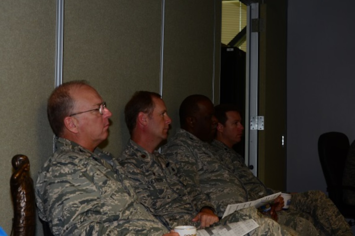 172d Airlift Wing Commanders participate in the production meeting daily, ensuring they know the most accurate aircraft data and can apply resources where needed.  Above seated from left to right are commanders within the group: Col. Lynn Cole, Maj. Dale Shepherd, Lt. Col. Tyrone Williams and Lt. Col. Wyatt Rives.