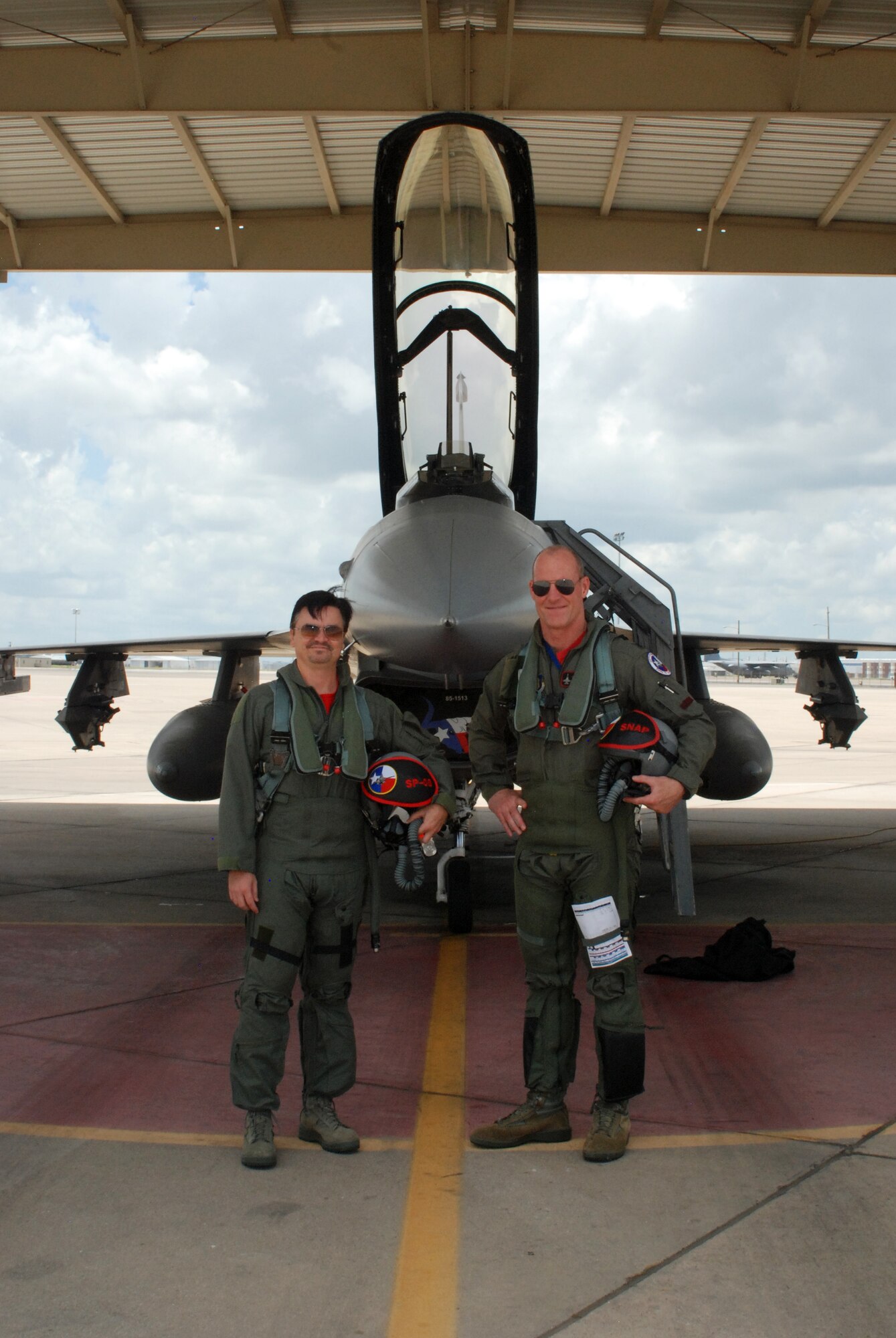 NAVAL AIR STATION FORT WORTH JOINT RESERVE BASE, Texas – Local lawyer, philanthropist and military supporter Mr. James Fleck receives an opportunity to visit here and fly in a F-16D June 12. Lt. Col. Lane Beene, director of operations for the 457th Fighter Squadron, was the honorary commander's pilot for the flight. Fleck became the squadron's honorary commander last December. (U.S. Air Force photo/Senior Airman Ben Calantas)