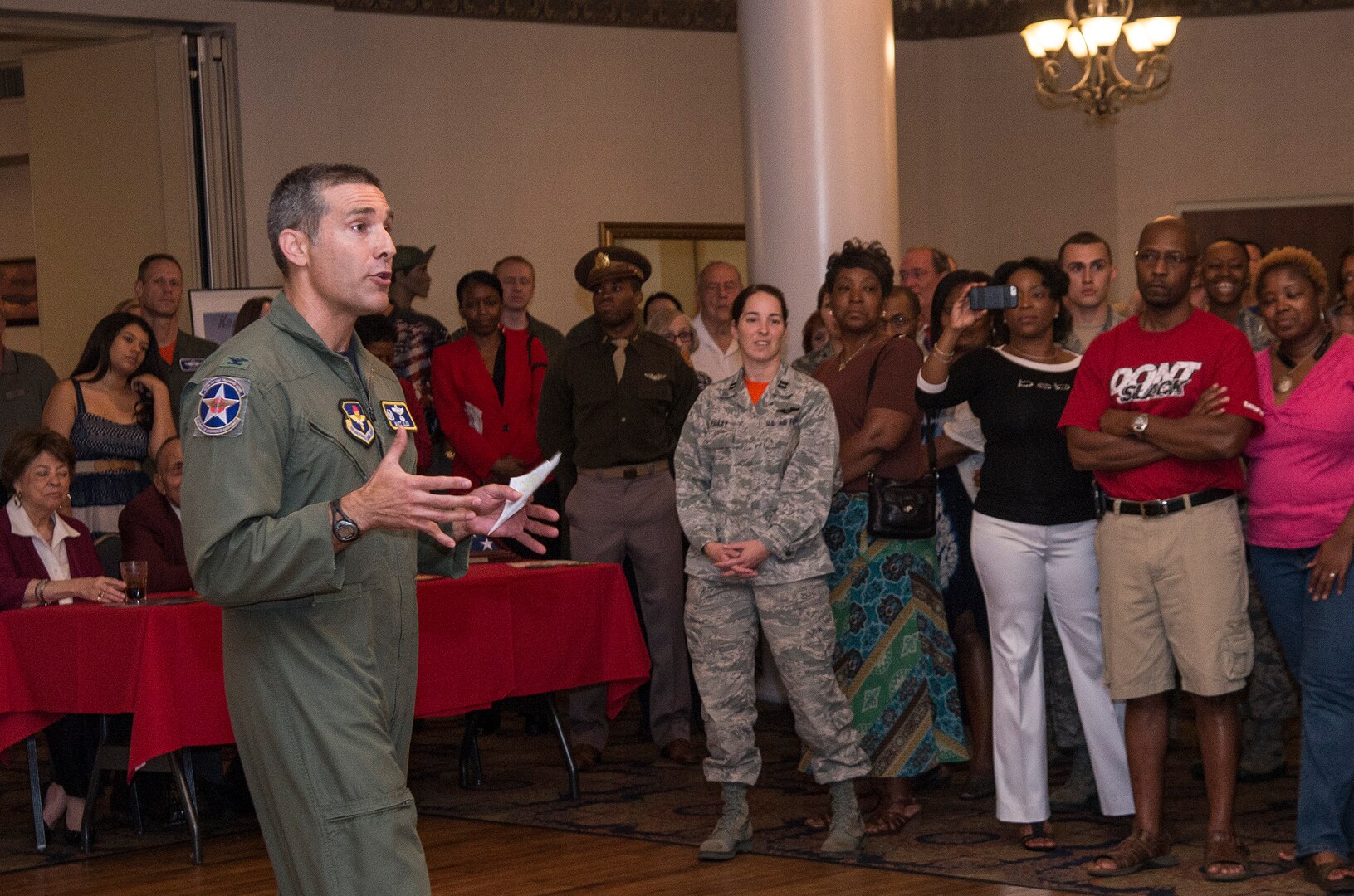 Col. Matthew Isler, 12th Flying Training Wing commander, addresses the crowd during the Tuskegee Airmen Tribute, June 12, 2015, at Joint Base San Antonio-Randolph’s Parr Club.  Members of the JBSA-Randolph community celebrated the legacy of the first all-black unit by paying tribute to seven of the documented original Tuskegee Airmen members.  The Tuskegee Airmen distinguished themselves during World War II with more than 15,500 sorties and 1,500 missions in Europe and North Africa and earned numerous combat awards.  The event featured musical entertainment, comments by 12th Flying Training Wing leaders, an introduction of four Tuskegee Airmen present and a presentation of gifts to them. Members of the audience had an opportunity to mingle with the Tuskegee Airmen and listen to their stories. (U.S. Air Force photo by Johnny Saldivar/released)