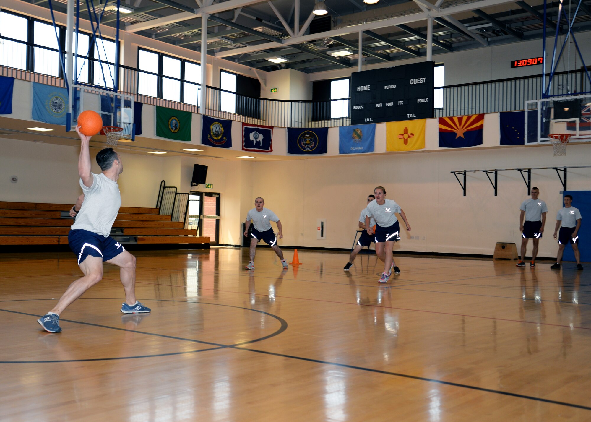 Team Mildenhall Airmen play dodge ball during the Marauder Melee event June 11, 2015, on RAF Mildenhall, England. The Marauder Melee is an annual competition featuring several events which promote fitness, friendly competition and camaraderie among various units on base. (U.S. Air Force photo by Senior Airman Kyla Gifford/Released)