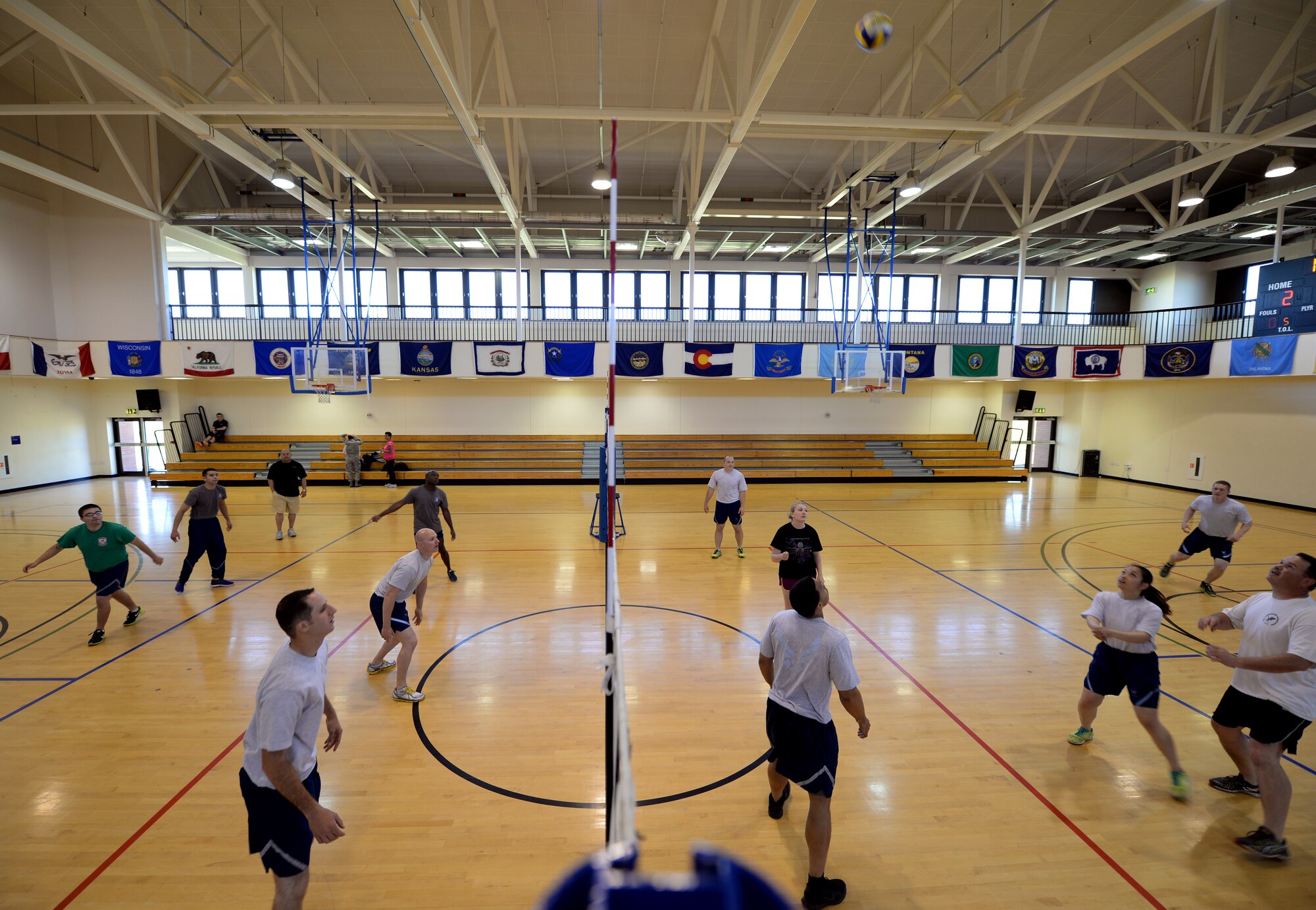 Team Mildenhall Airmen compete in a volleyball tournament during the Marauder Melee event June 11, 2015, on RAF Mildenhall, England. The Marauder Melee is a sports competition between squadrons throughout the installation. The event was open to all base ID card holders and included various sports such as basketball, table tennis, dodge ball, tennis and more. (U.S. Air Force photo by Senior Airman Kyla Gifford/Released)