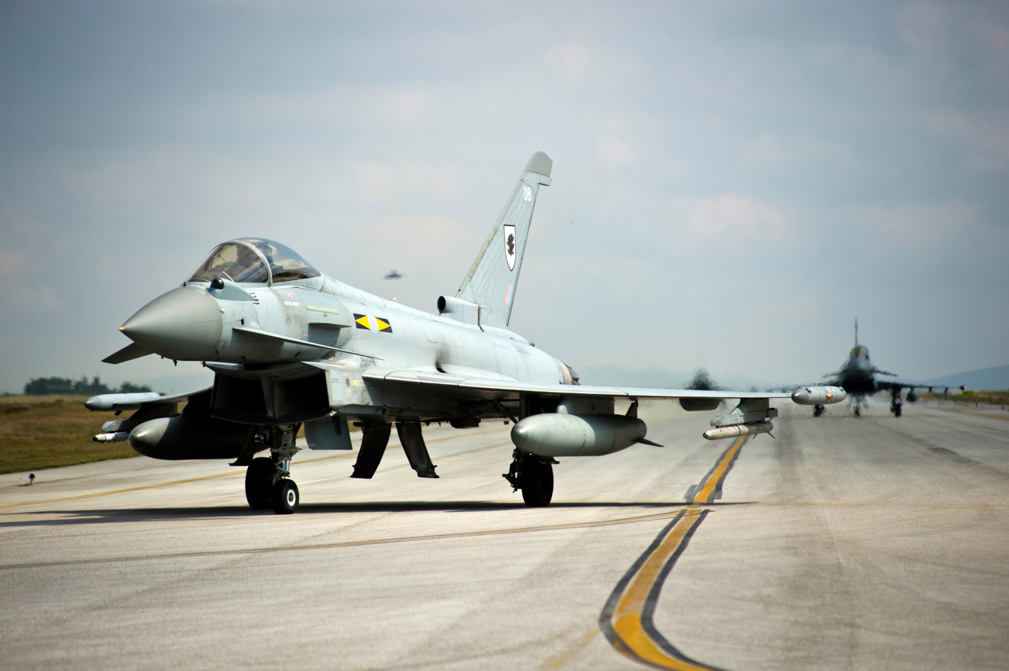 Royal Air Force Typhoon FGR4 aircraft taxi to the runway during Anatolian Eagle 15, June 11, 2015, at 3rd Main Jet Base, Turkey. Anatolian Eagle is a two-week flying training exercise involving U.S. Air Forces in Europe units and multiple NATO partners. (U.S. Air Force photo by Tech. Sgt. Eric Burks/Released)