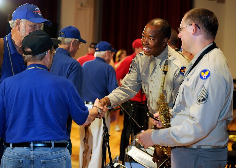 U.S. Air Force Band Airmen of Note members meet with Korean War veterans after a concert June 13, 2015, at Joint Base Anacostia-Bolling, D.C. In honor of the veterans’ service, the Airmen of Note wore period uniforms similar to what would have been worn during the Korean War. (U.S. Air Force photo by Senior Airman Preston Webb/Released)