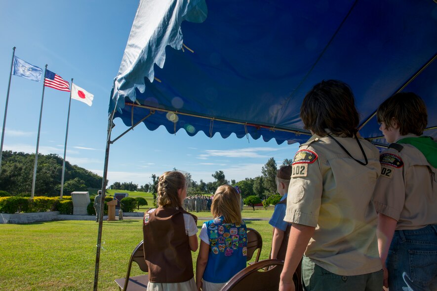 Kadena’s Girl Scouts and Cub Scouts Pack 102 recite the Pledge of Allegiance during the National Flag Day ceremony on Kadena Air Base, Japan, June 15, 2015. Displaying the flag and giving it a distinctive fold shows respect and expresses gratitude toward those who have fought and continue to fight for freedom at home and abroad. (U.S. Air Force photo by Senior Airman Stephen G. Eigel)