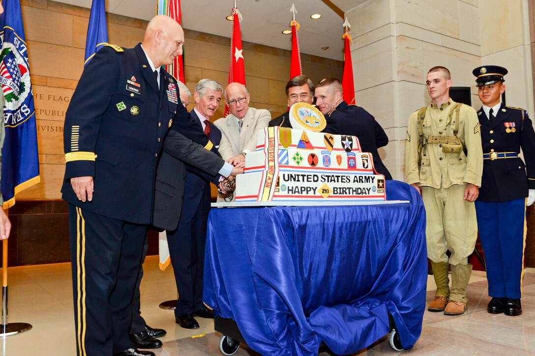 Army Chief of Staff Gen. Ray Odierno, U.S. Sen. Jim Inhofe, of Oklahoma, Army Secretary John M. McHugh, U.S. Sen. Pat Roberts, of Kansas, and Sgt. Maj. of the Army Daniel A. Dailey cut the ceremonial cake during the 240th Army Birthday Capitol Hill Cake Cutting Ceremony at the U.S. Capitol Visitors' Atrium in Washington, June 10, 2015. 