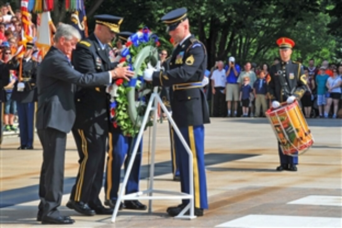 Army Secretary John McHugh, Army Chief of Staff Gen. Ray Odierno and Sgt. Maj. of the Army Daniel Dailey place a wreath at the Tomb of the Unknown Soldier at Arlington National Cemetery in Arlington, Va., June 14, 2015, during a commemoration of the Army’s 240th birthday.