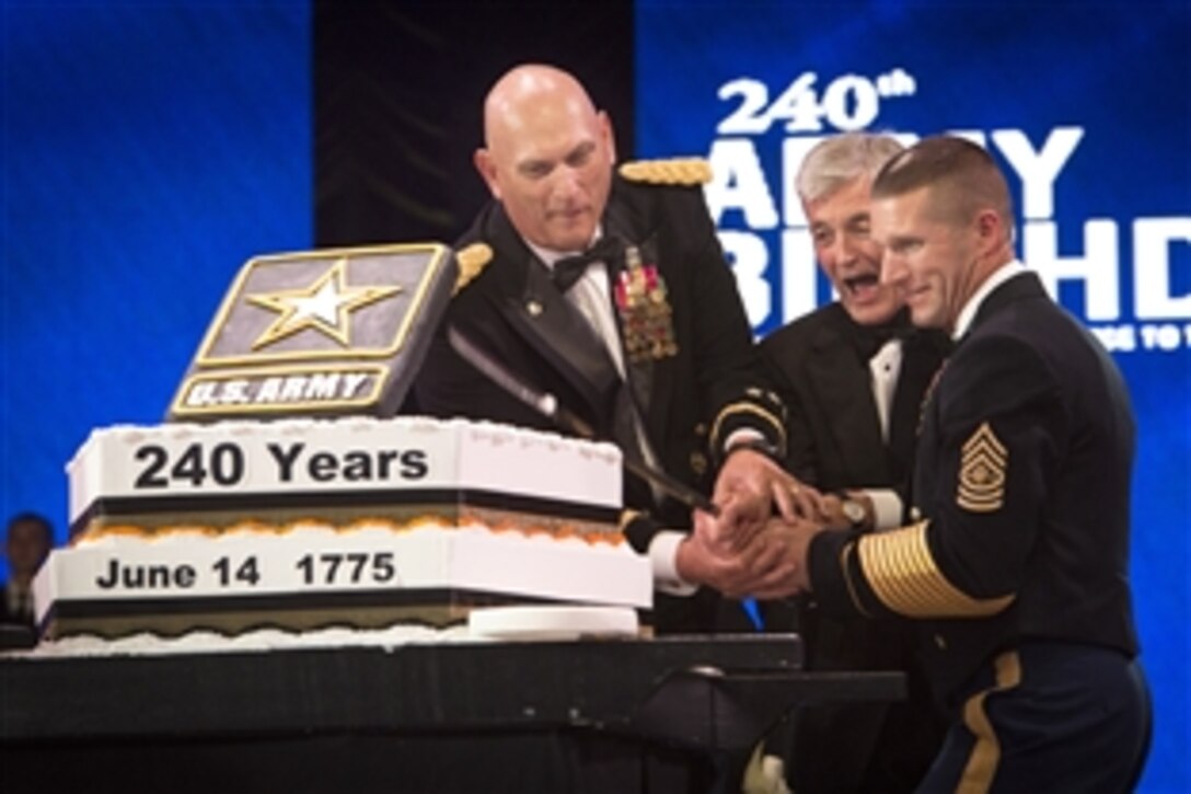 Army Secretary John McHugh, center, Army Chief of Staff Gen. Ray Odierno, left, and Sgt. Maj. of the Army Daniel A. Dailey, right, cut the Army birthday cake during the 2015 Army Ball in Washington D.C., June 13, 2015. The Army leaders were celebrating 240 years of service a day early; the Army was established on June 14, 1775.